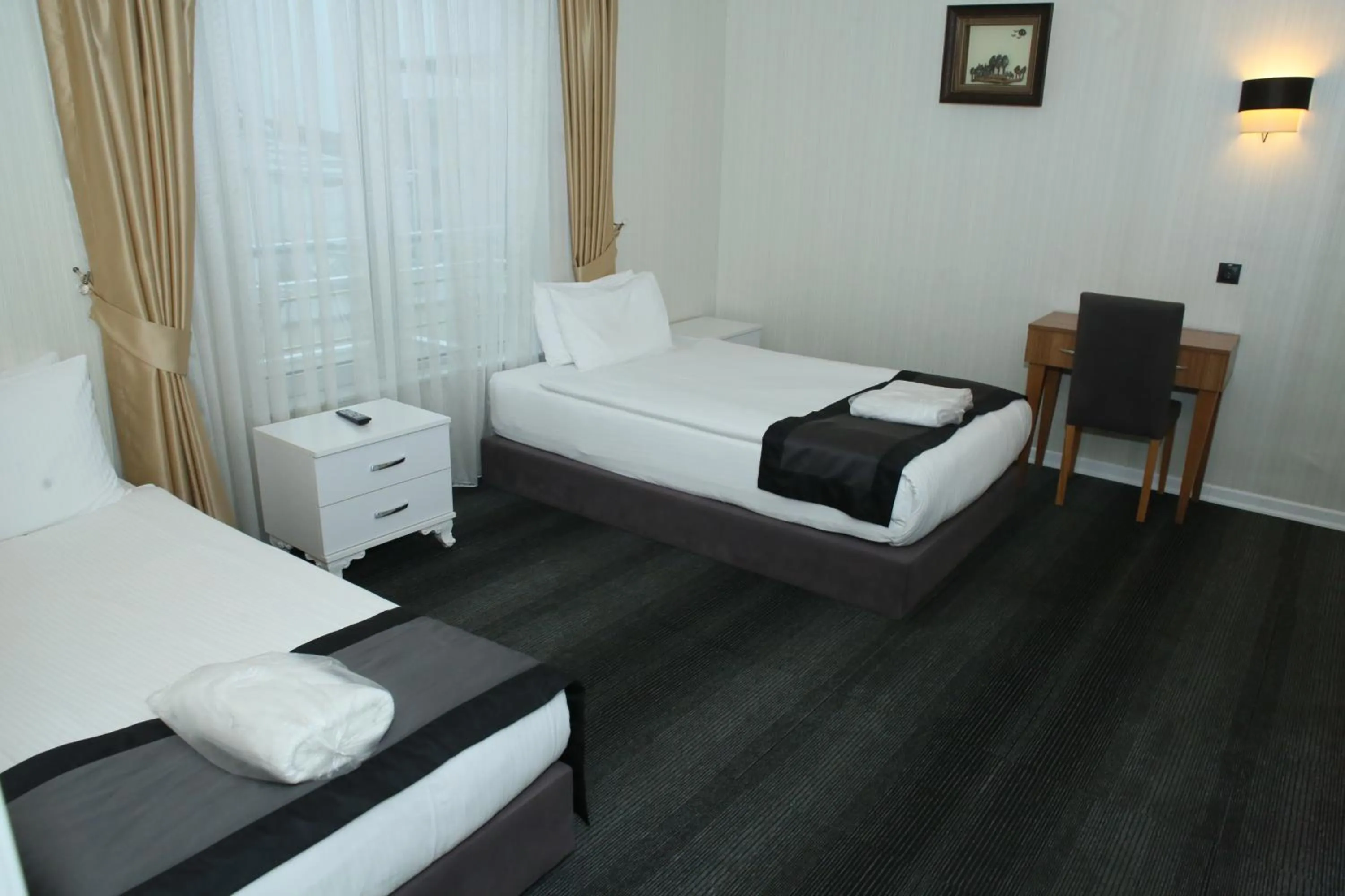 Bed in Grand Silay Hotel