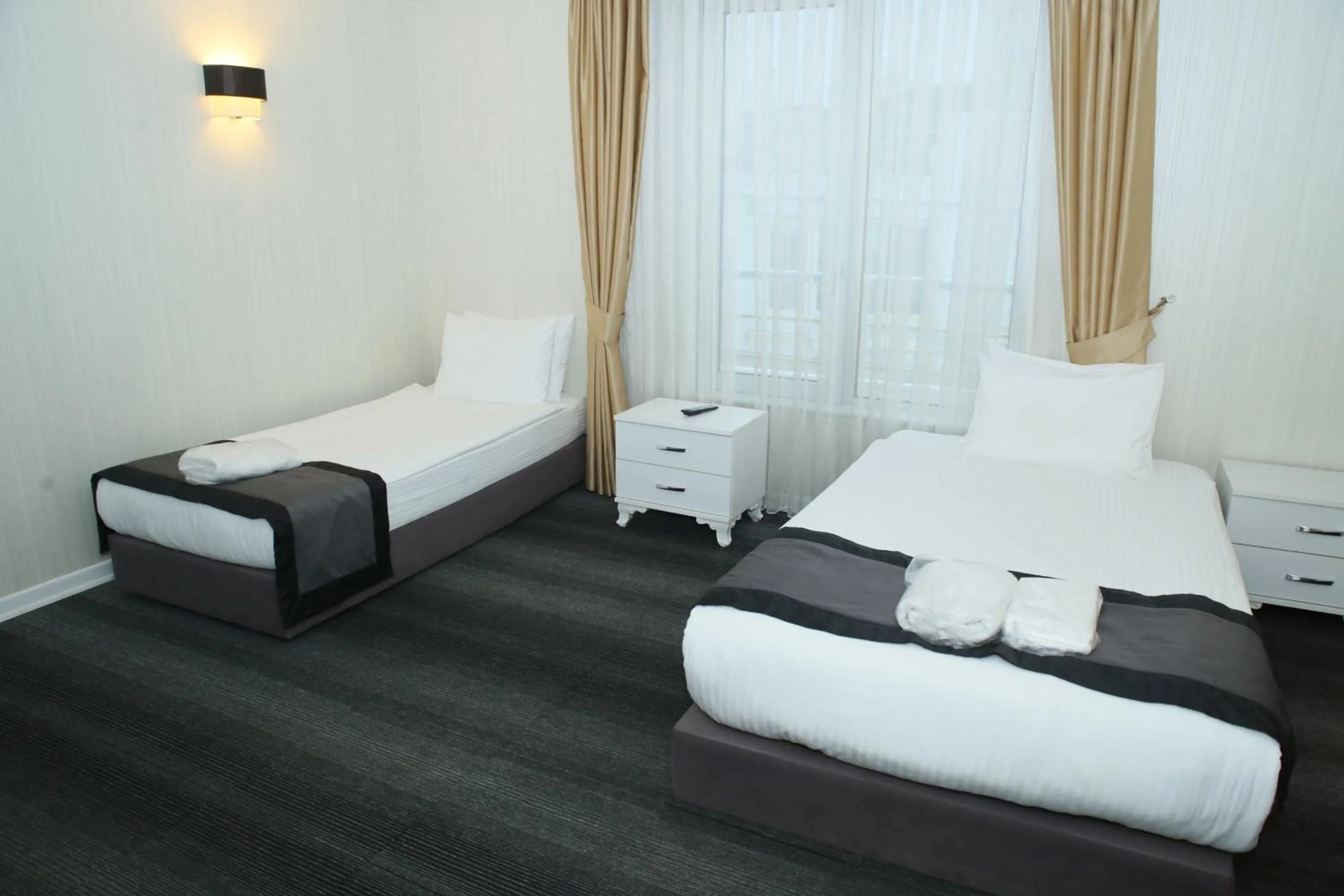 Bed in Grand Silay Hotel