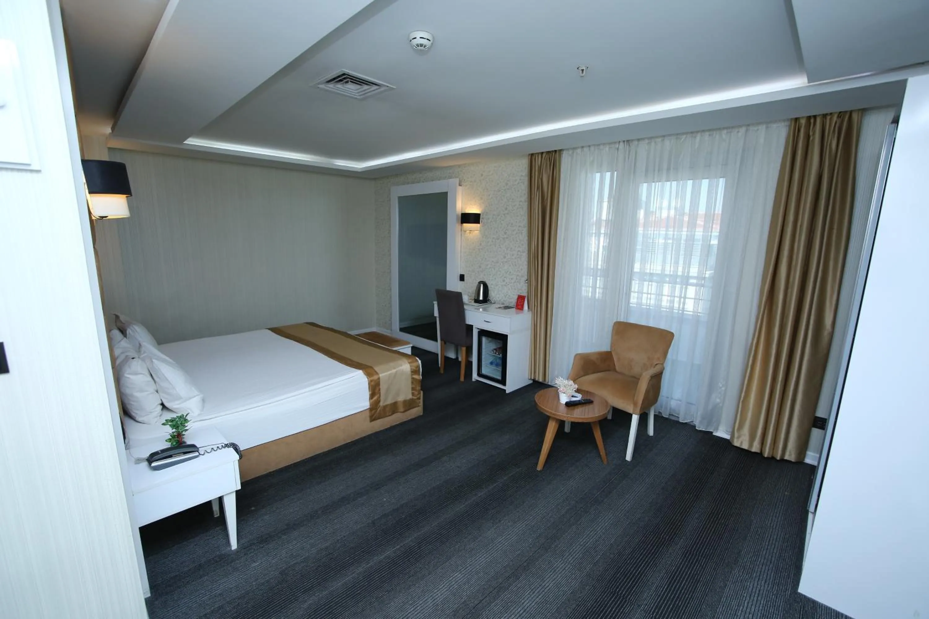 Bed in Grand Silay Hotel