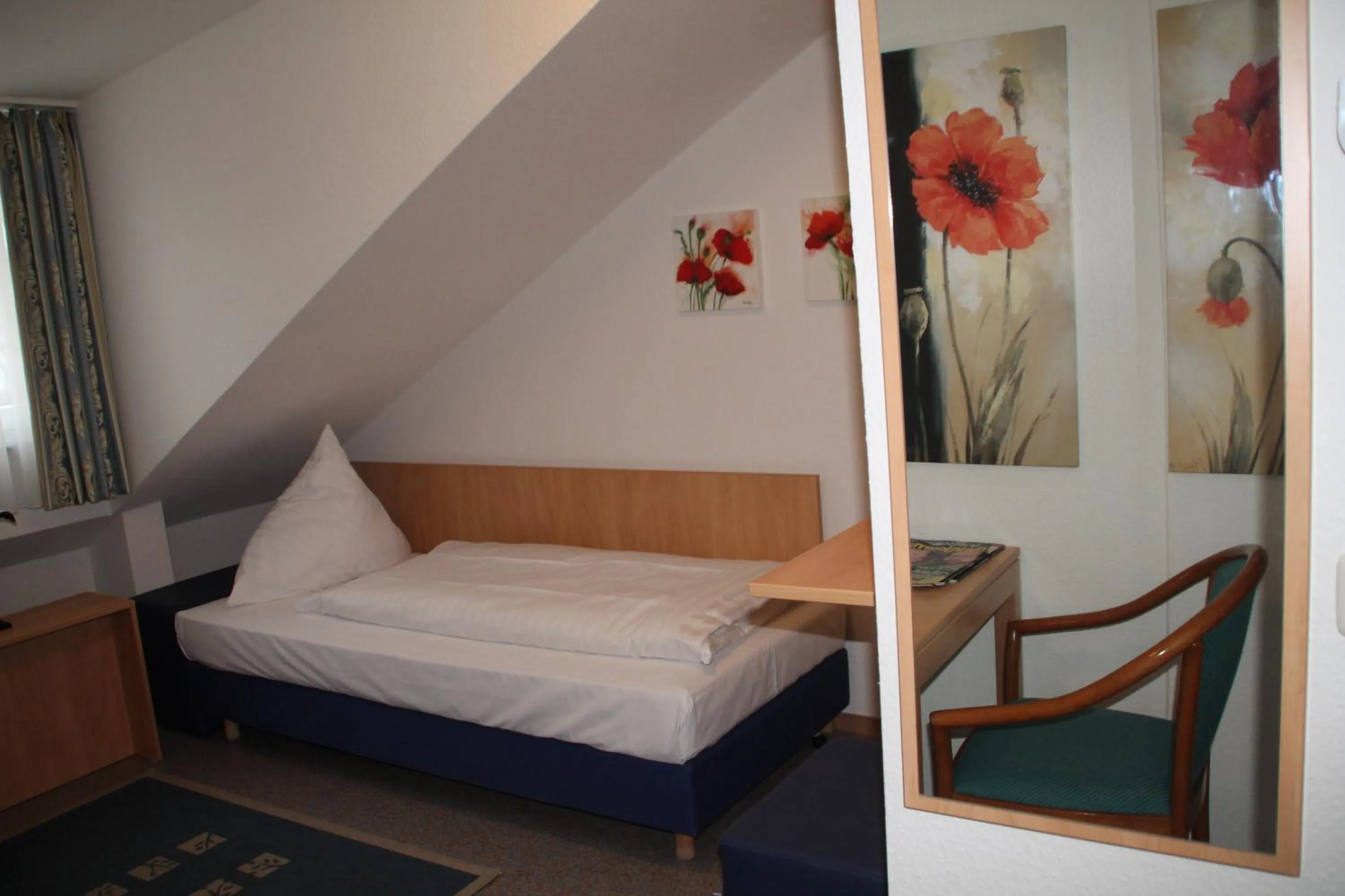 Photo of the whole room, Bed in RIESENjunior Hanau by Trip Inn