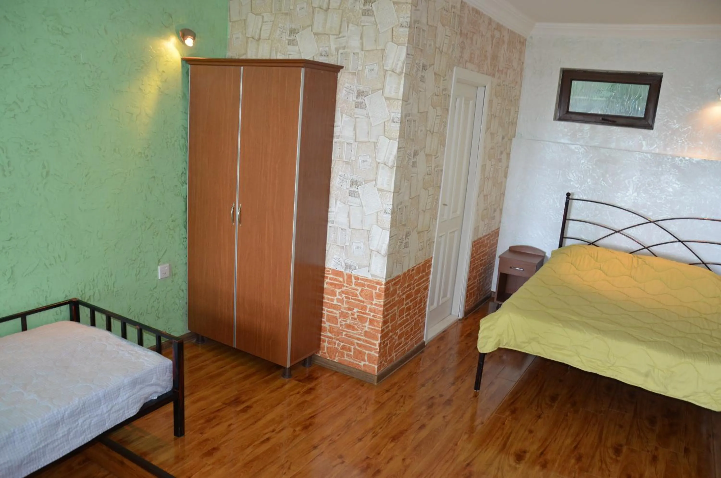 Photo of the whole room, Bed in TJ Guest House