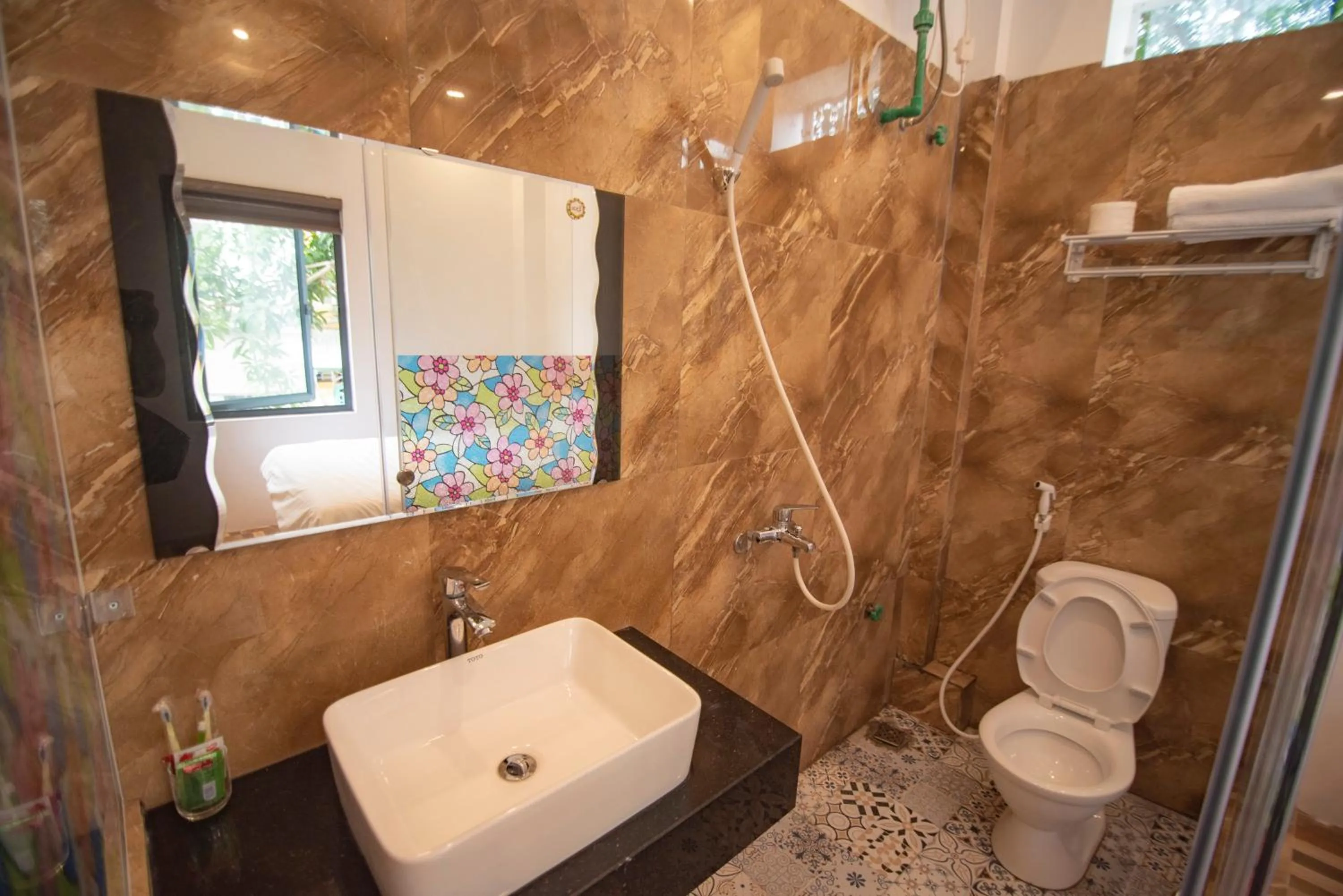 Bathroom in Long Hotel and motobike rental