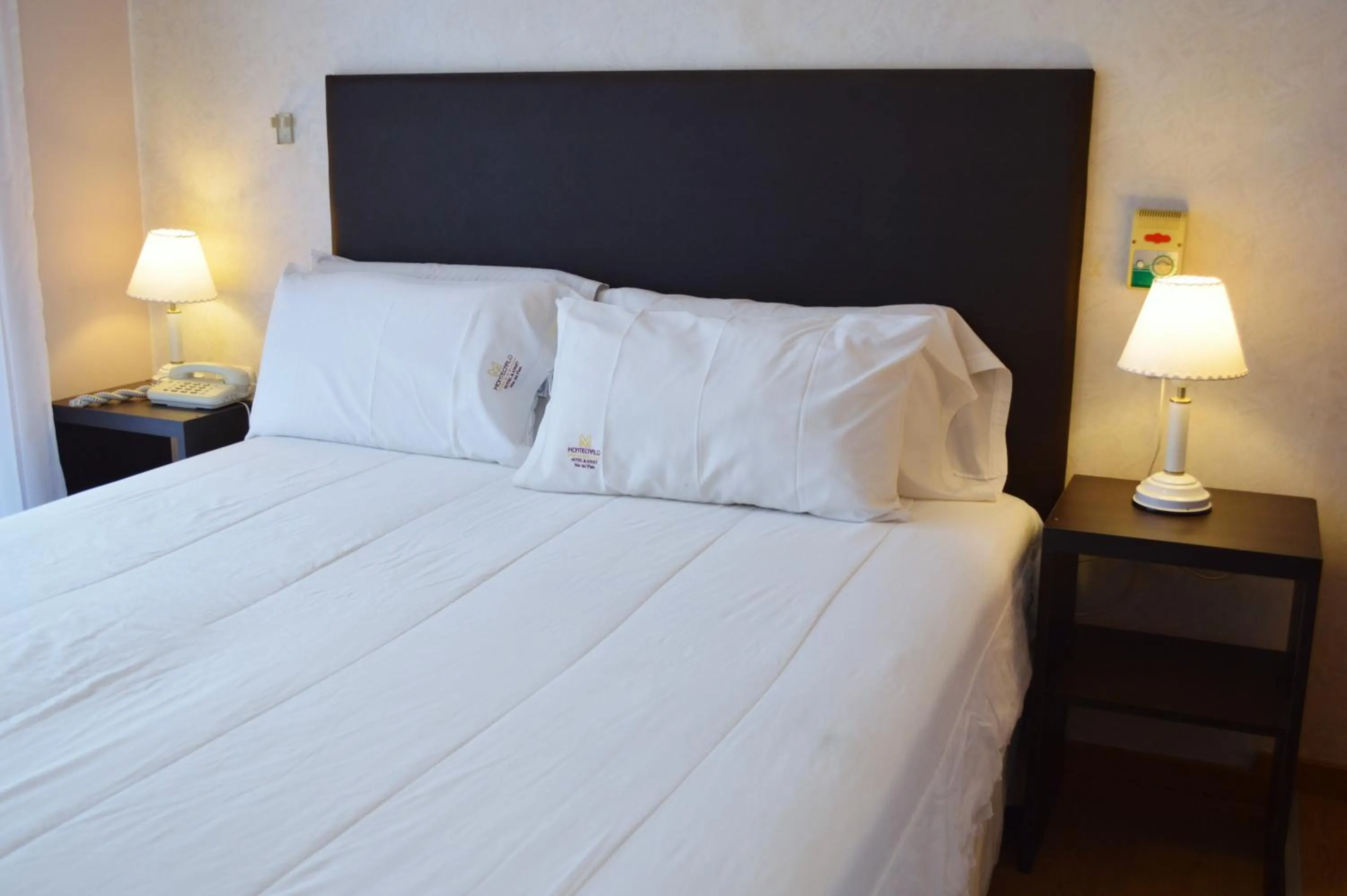 Bed in Montecarlo Apartment & Suite
