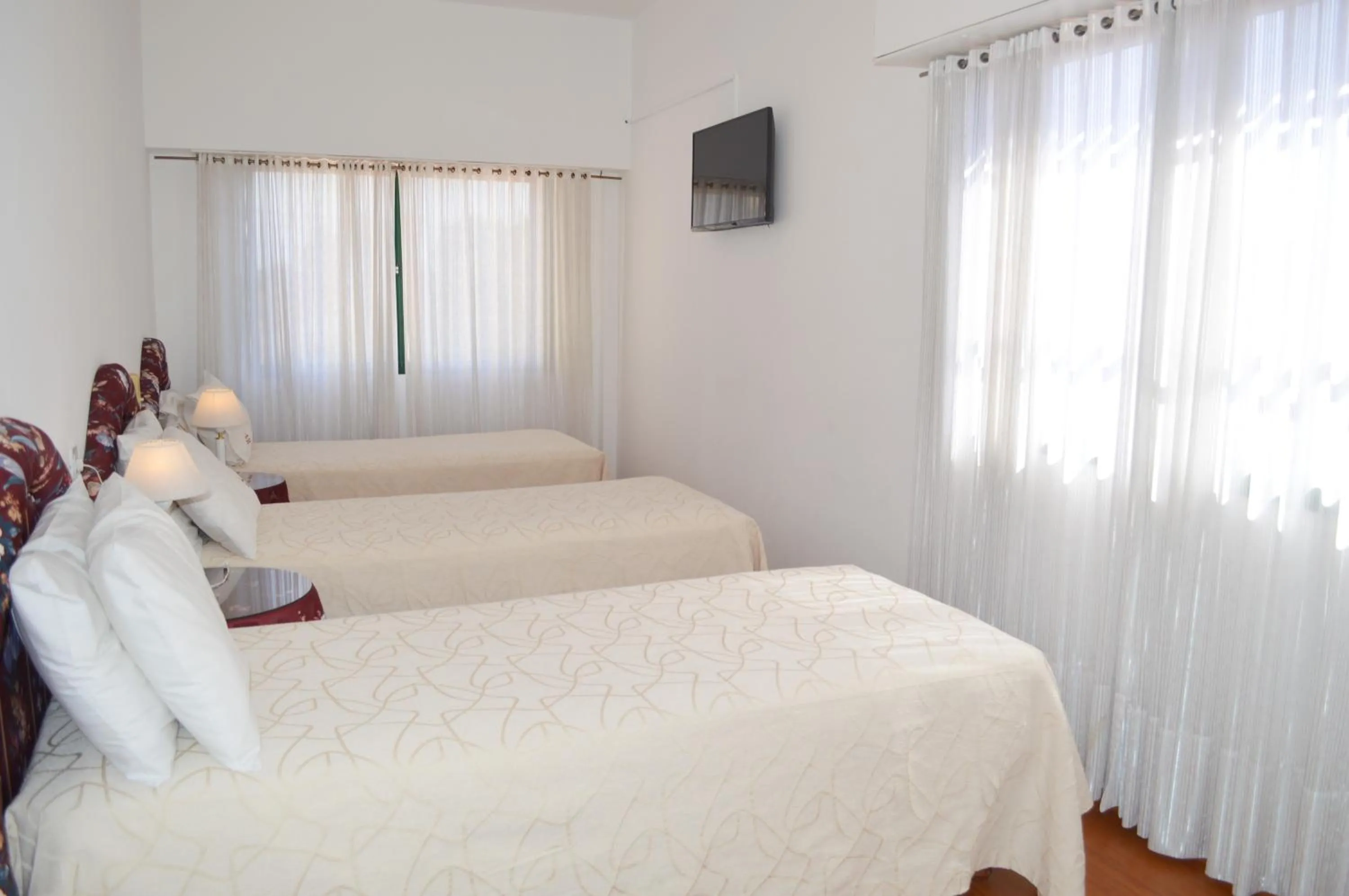 Bed in Montecarlo Apartment & Suite