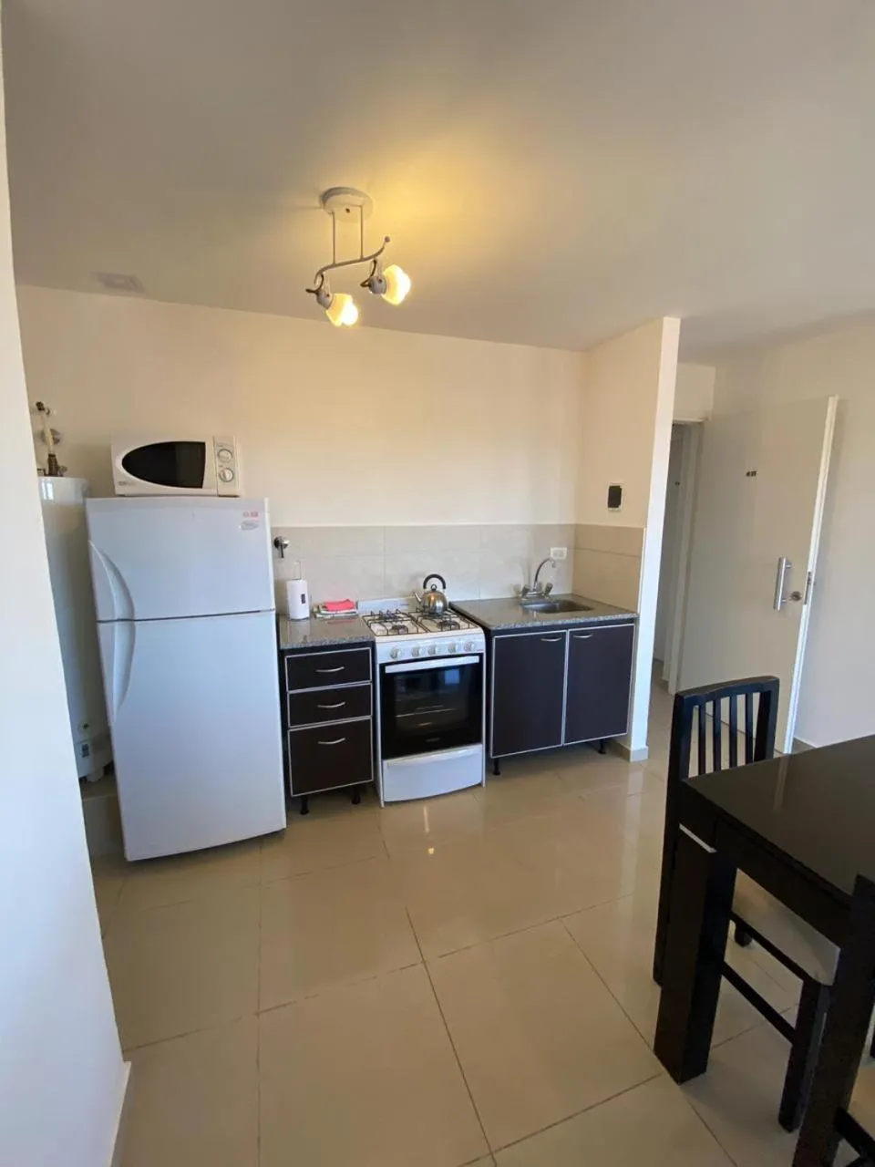 Kitchen or kitchenette in Montecarlo Apartment & Suite