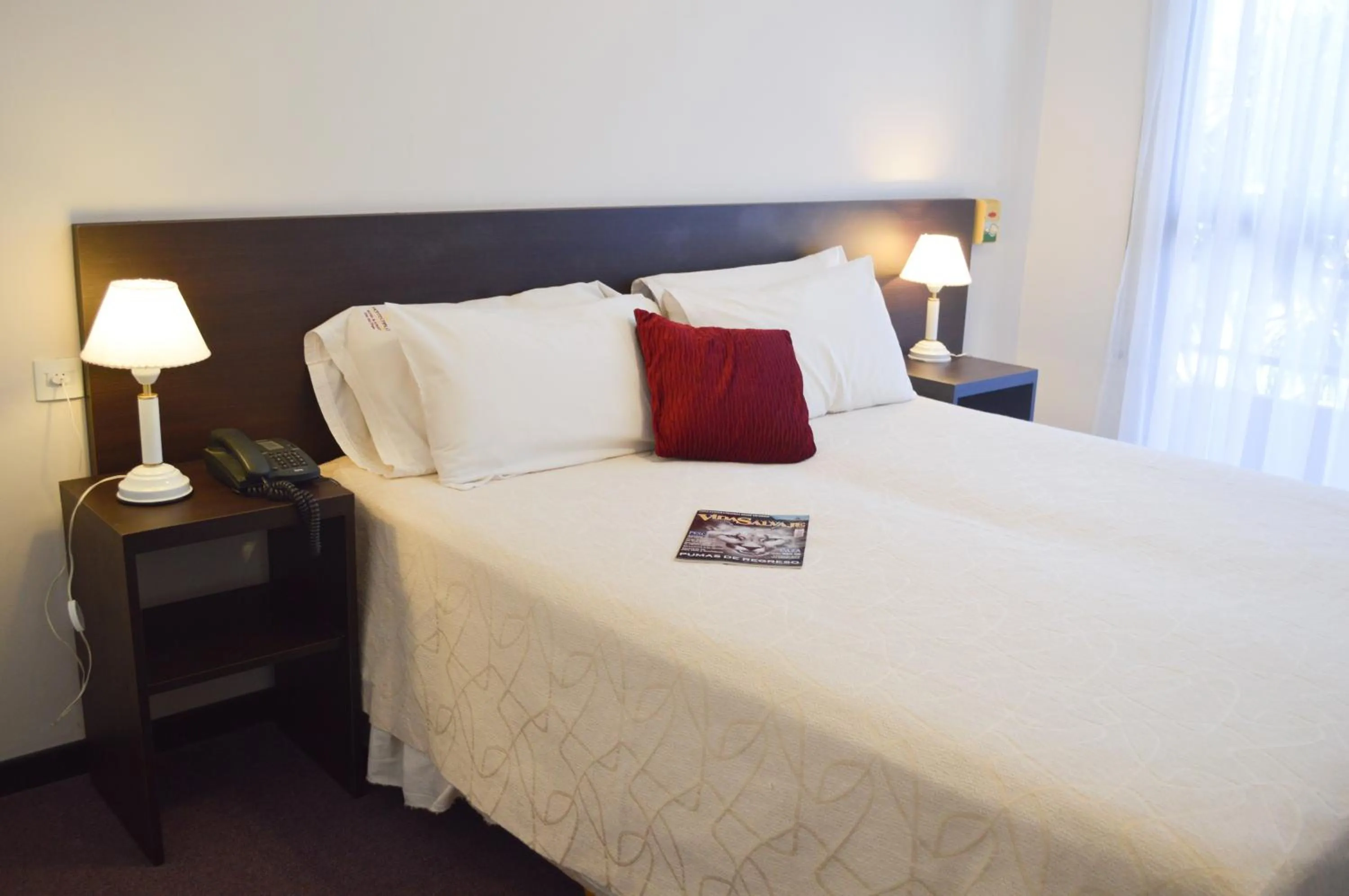 Bed in Montecarlo Apartment & Suite