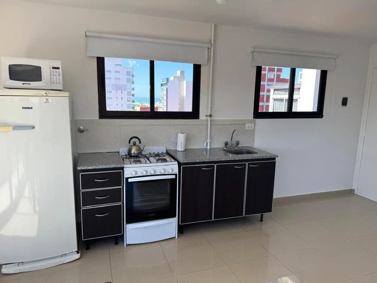Kitchen or kitchenette in Montecarlo Apartment & Suite