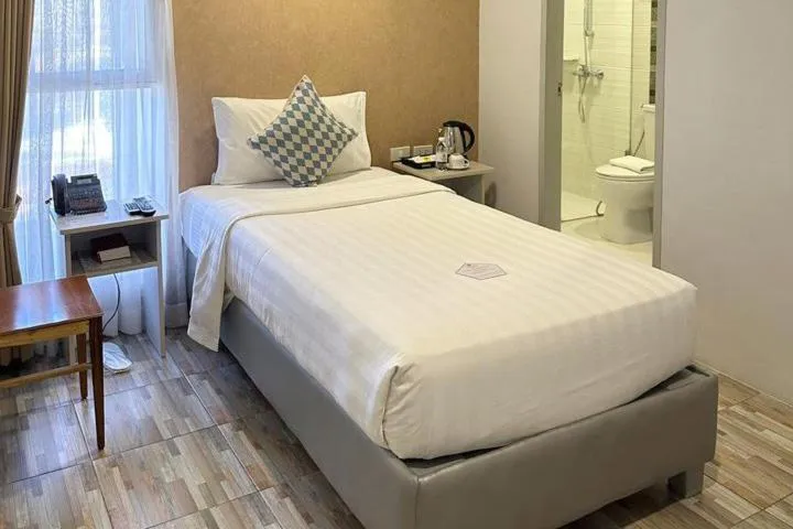 Bed in Amethyst Boutique Hotel Cebu powered by Cocotel