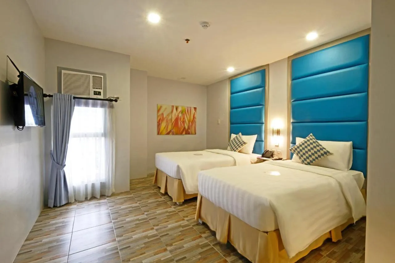 Bed in Amethyst Boutique Hotel Cebu powered by Cocotel
