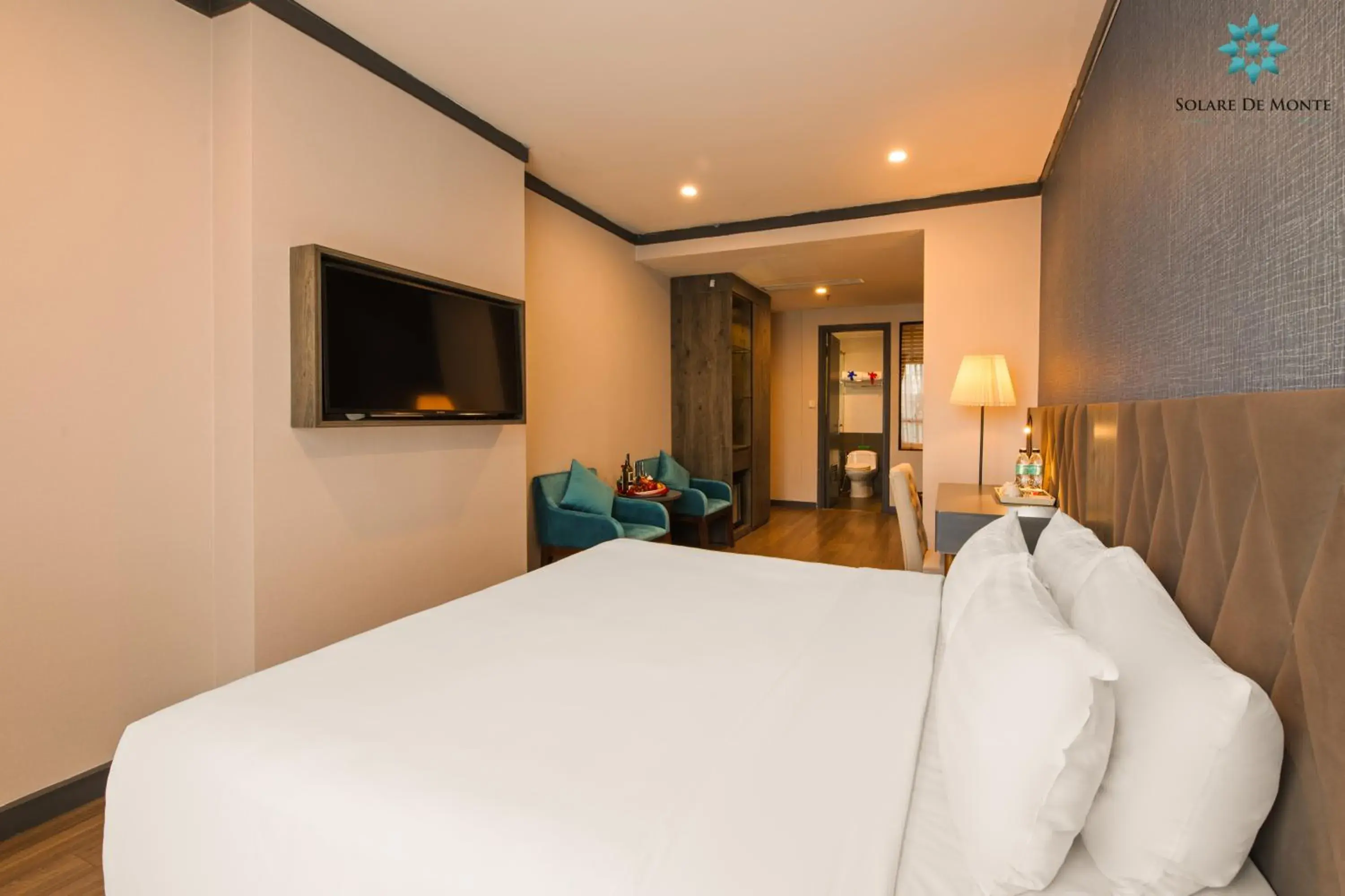 Communal lounge/ TV room, Bed in Solare De Monte Hotel & Spa Communal lounge/ TV room, Bed in Solare De Monte Hotel & Spa