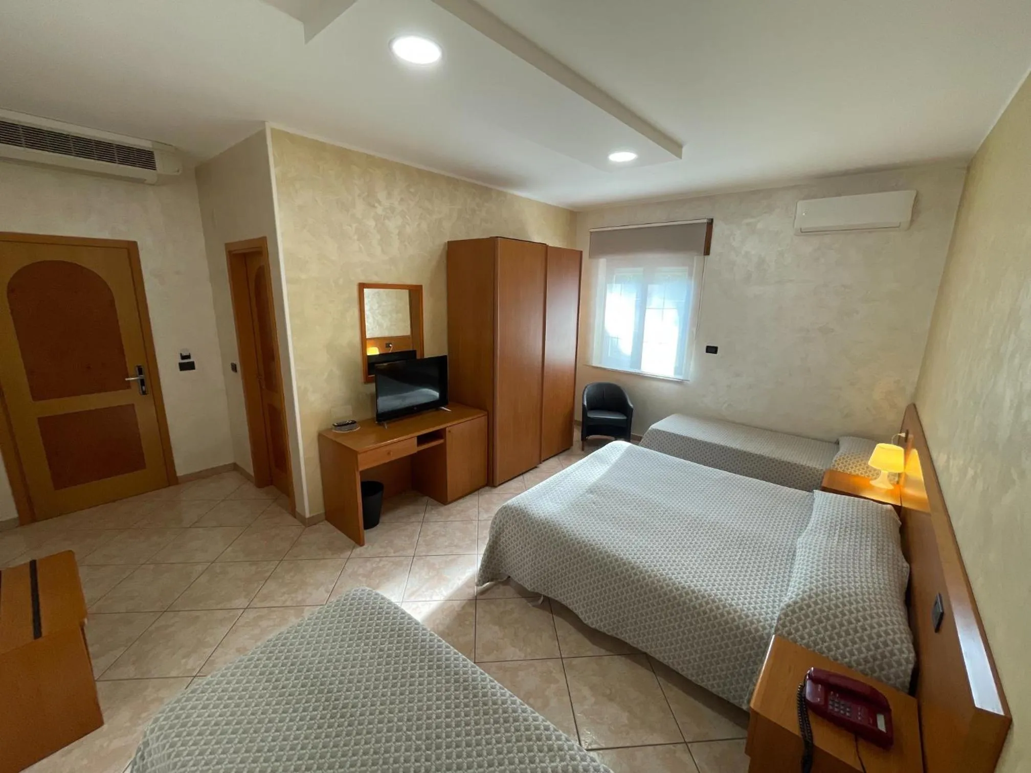 Bed in Hotel Toscano