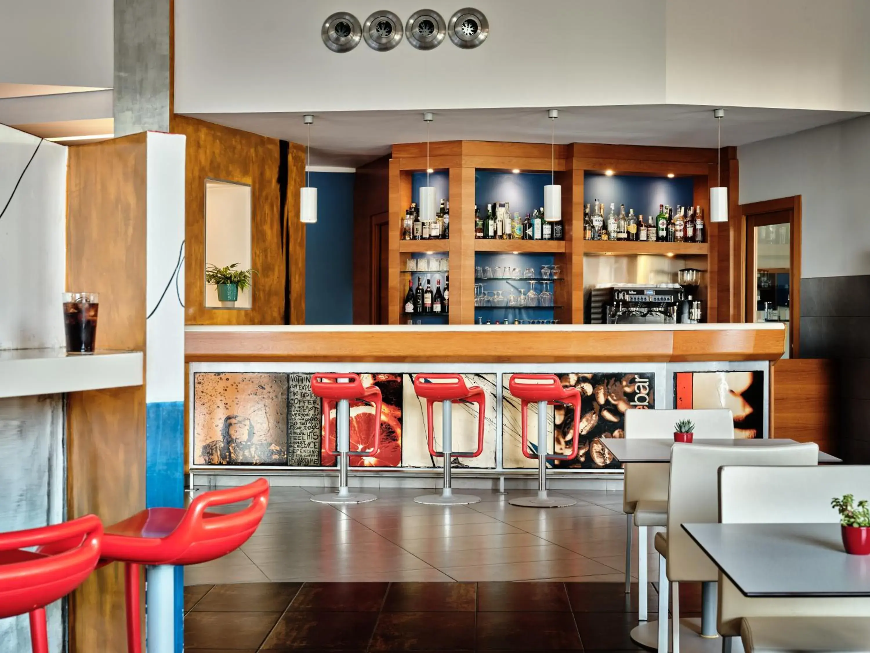 Lounge or bar in Holiday Inn Express Milan-Malpensa Airport by IHG Lounge or bar in Holiday Inn Express Milan-Malpensa Airport by IHG