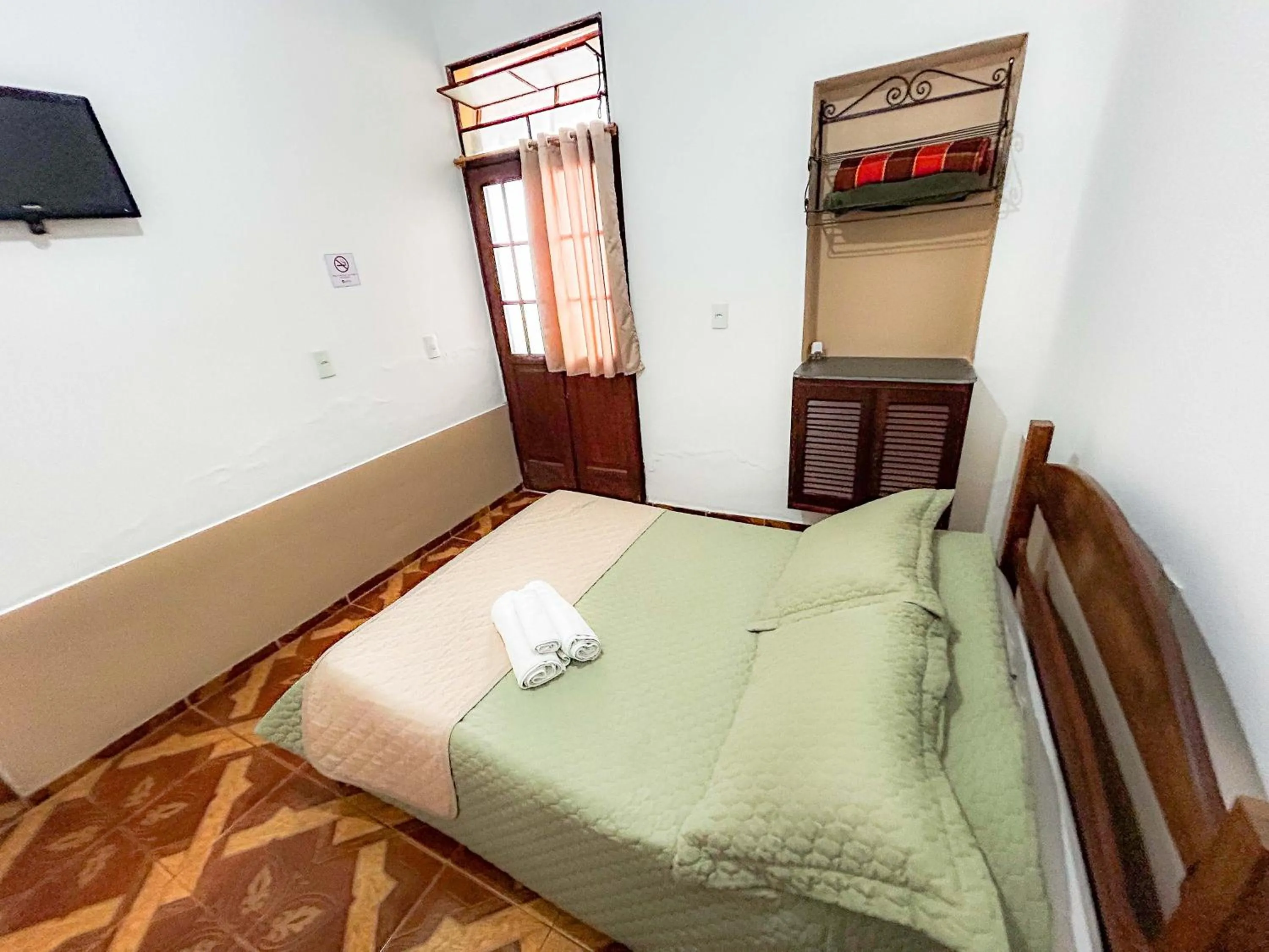 Bed in Pousada dos Sinos