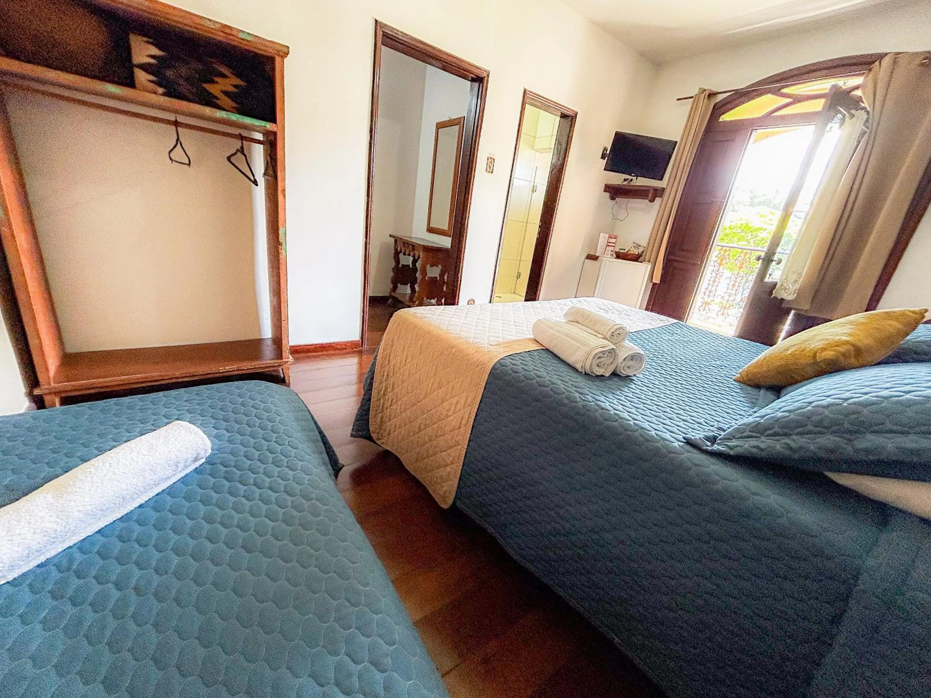 Bed in Pousada dos Sinos