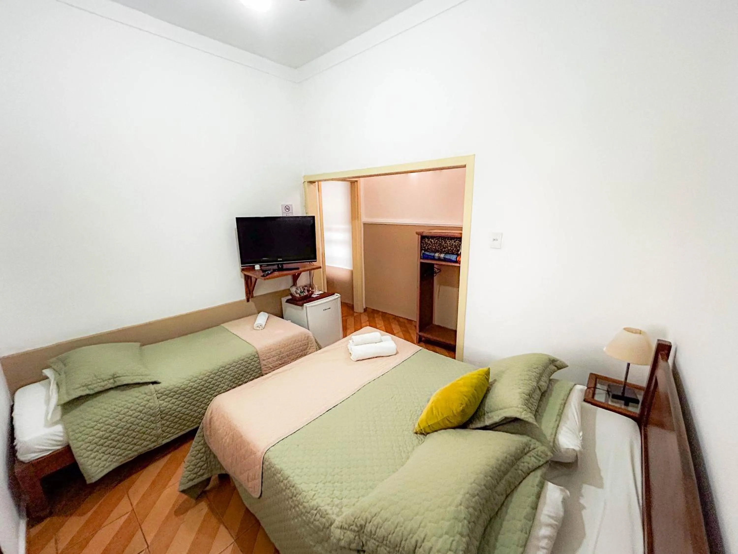 Bed in Pousada dos Sinos