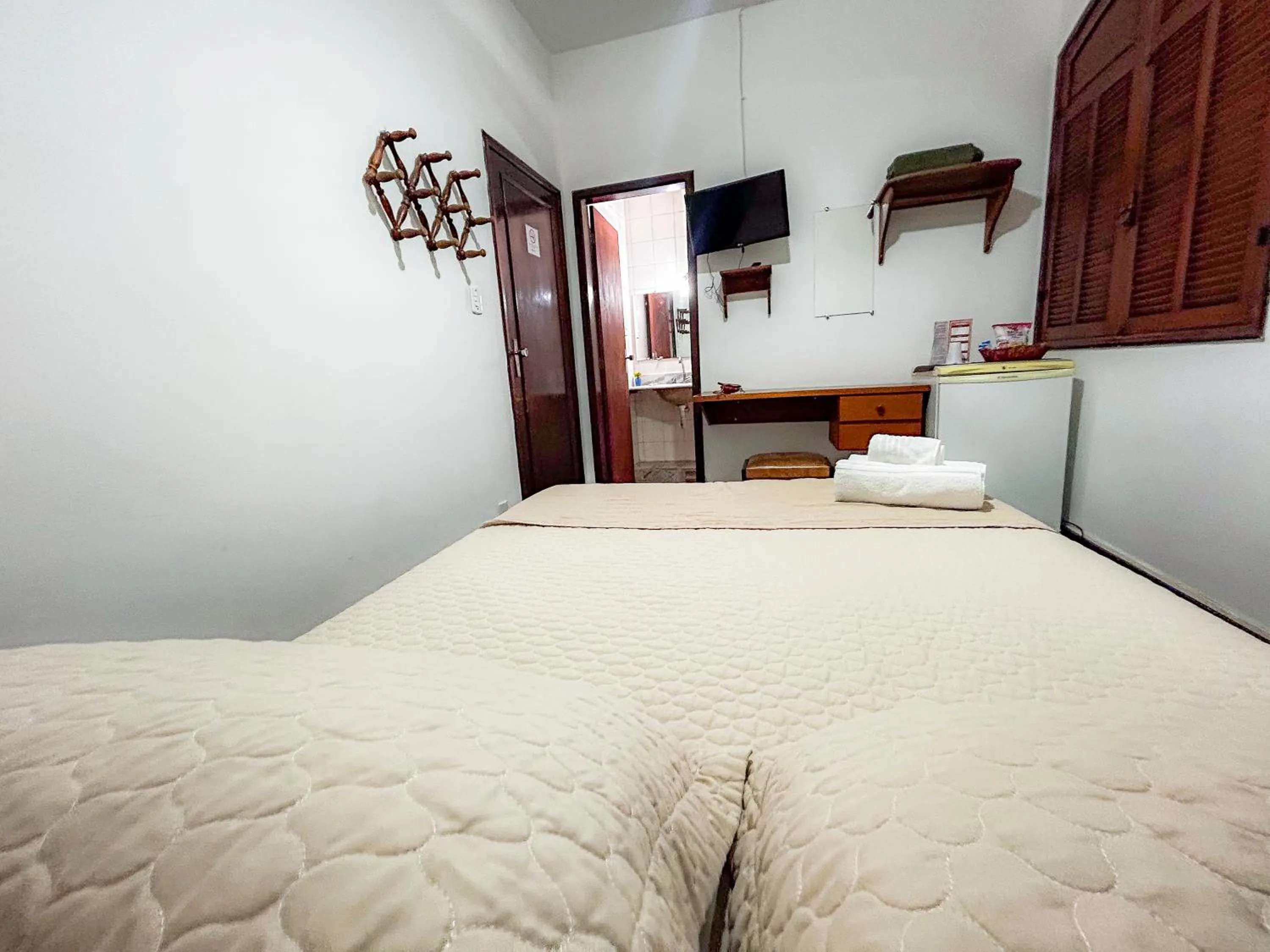 Bed in Pousada dos Sinos