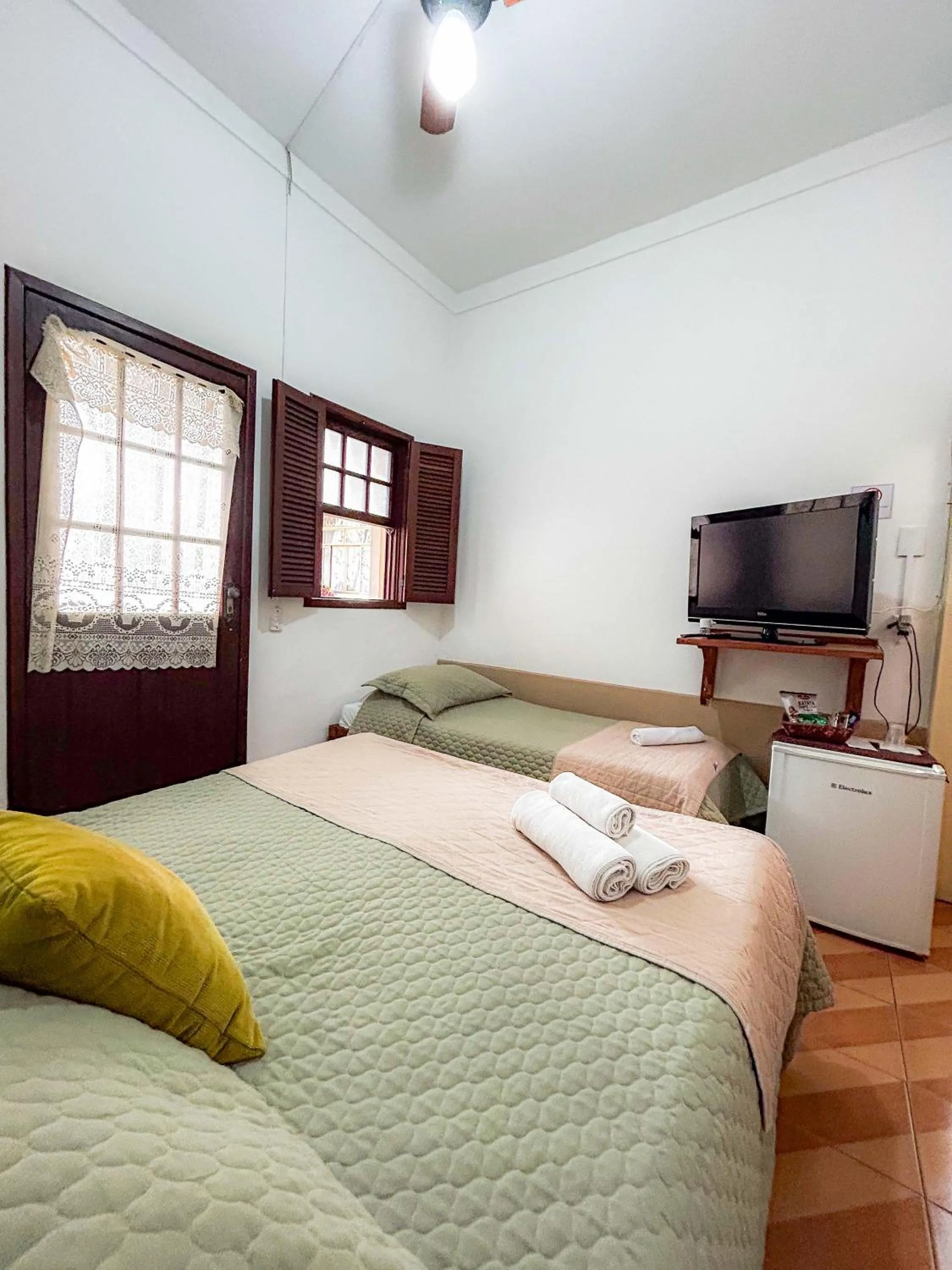 Bed in Pousada dos Sinos