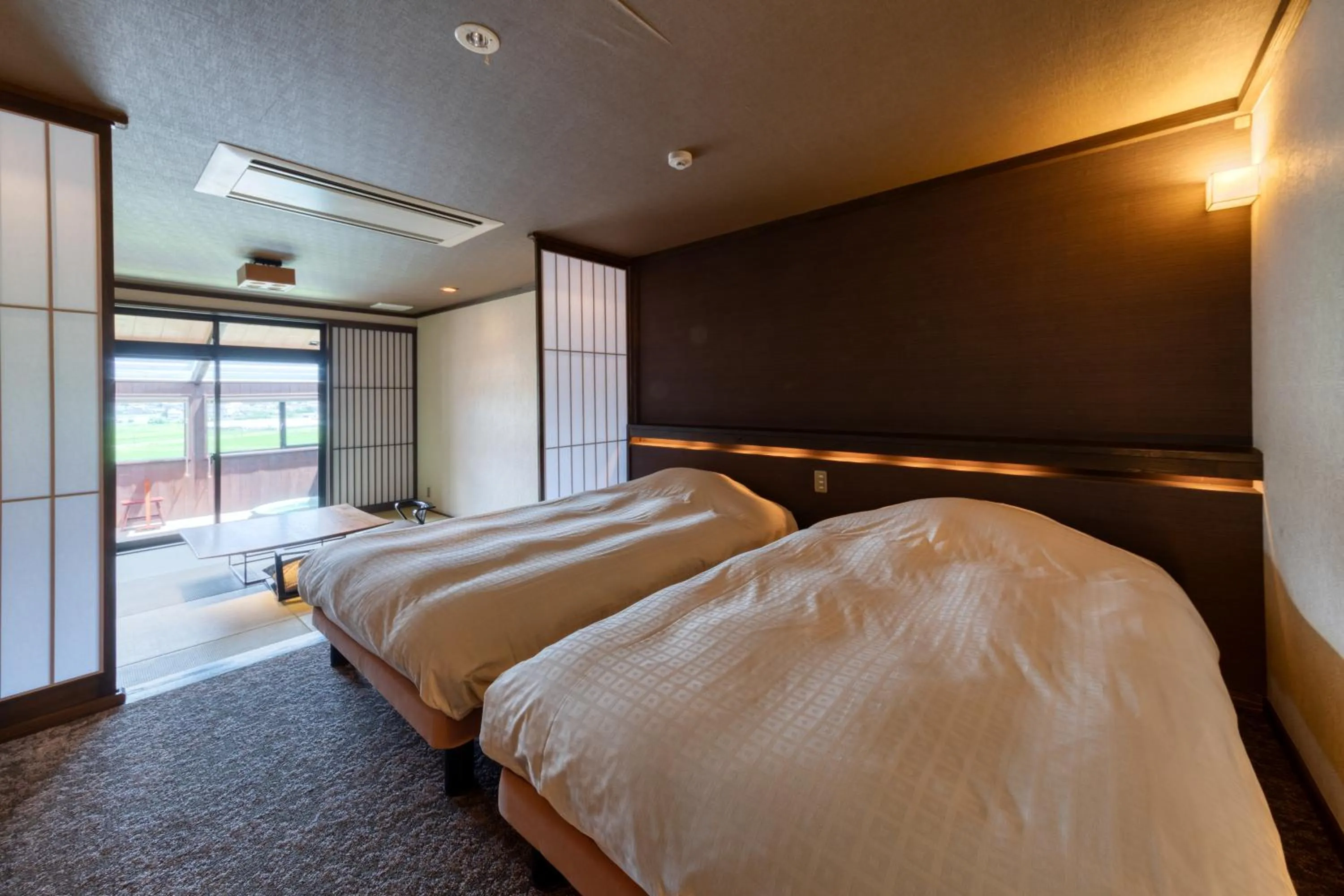 Bed in Yufuin Onsen Toshoan