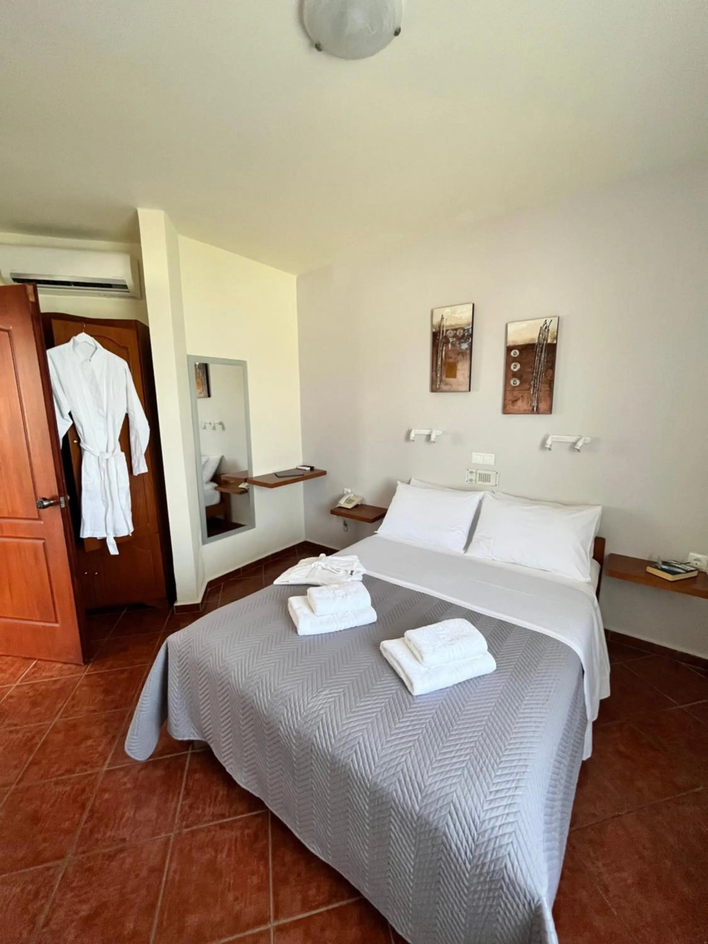 Bed in Iolkos Hotel Apartments