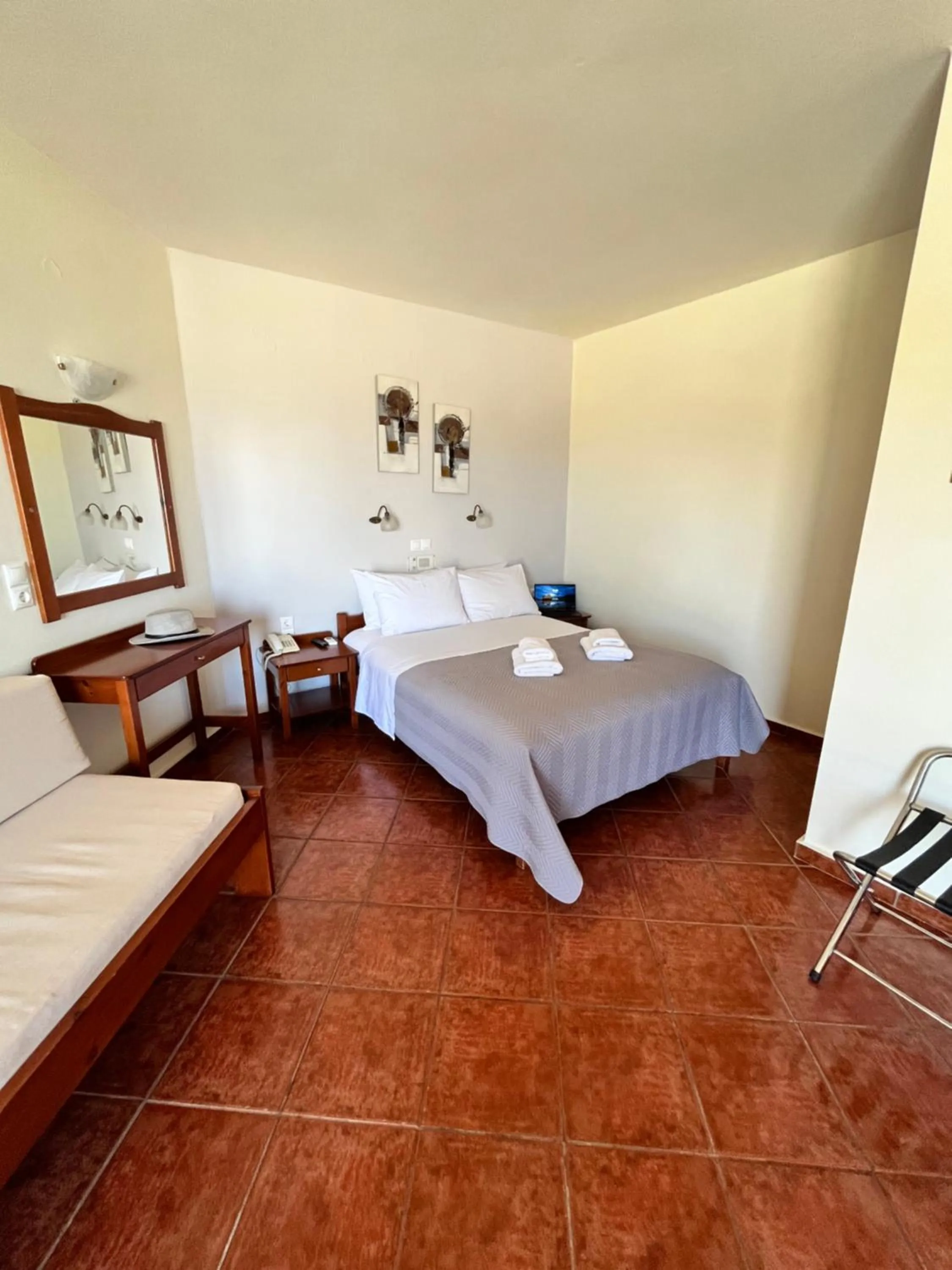 Bed in Iolkos Hotel Apartments