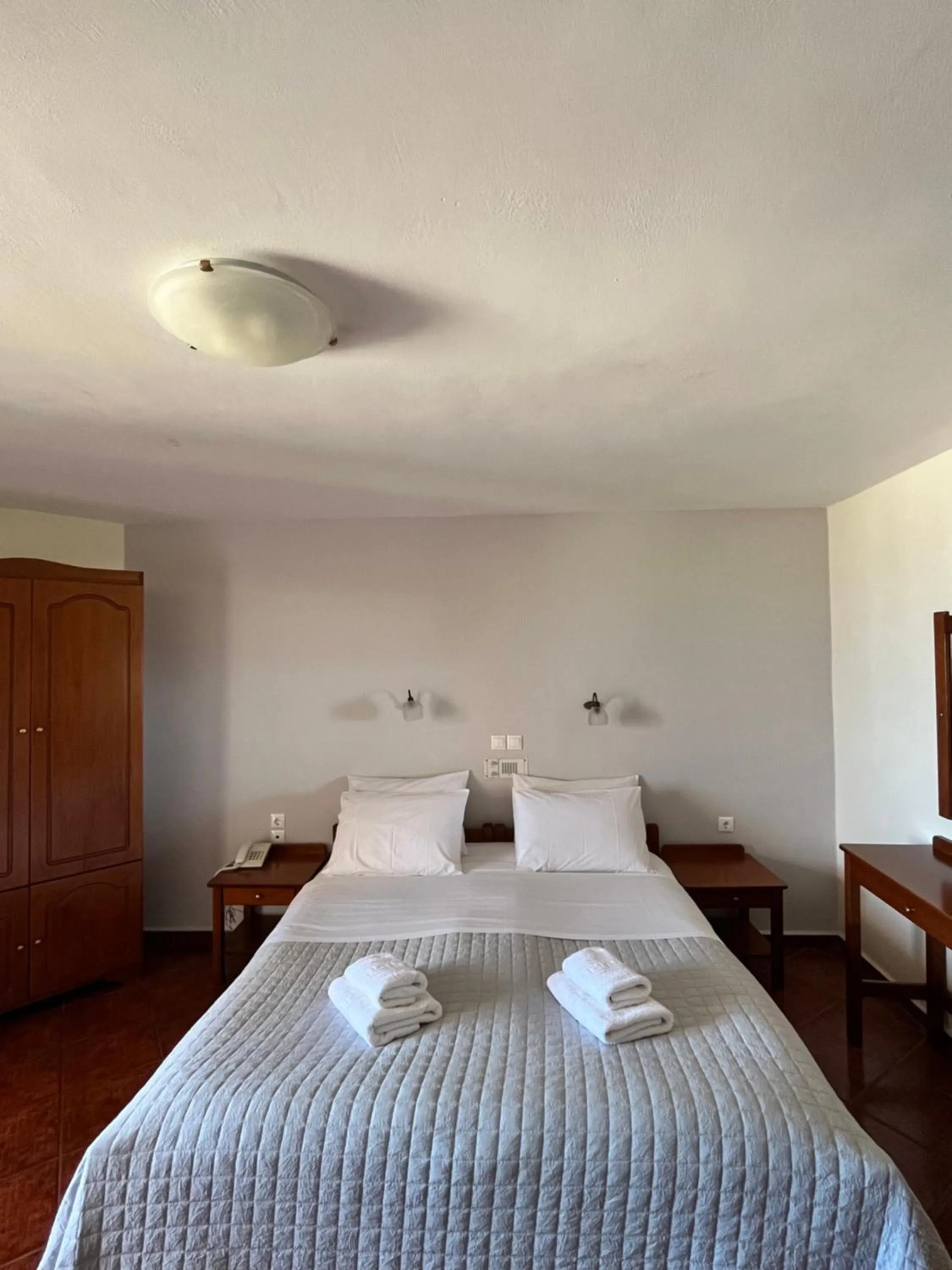 Bed in Iolkos Hotel Apartments