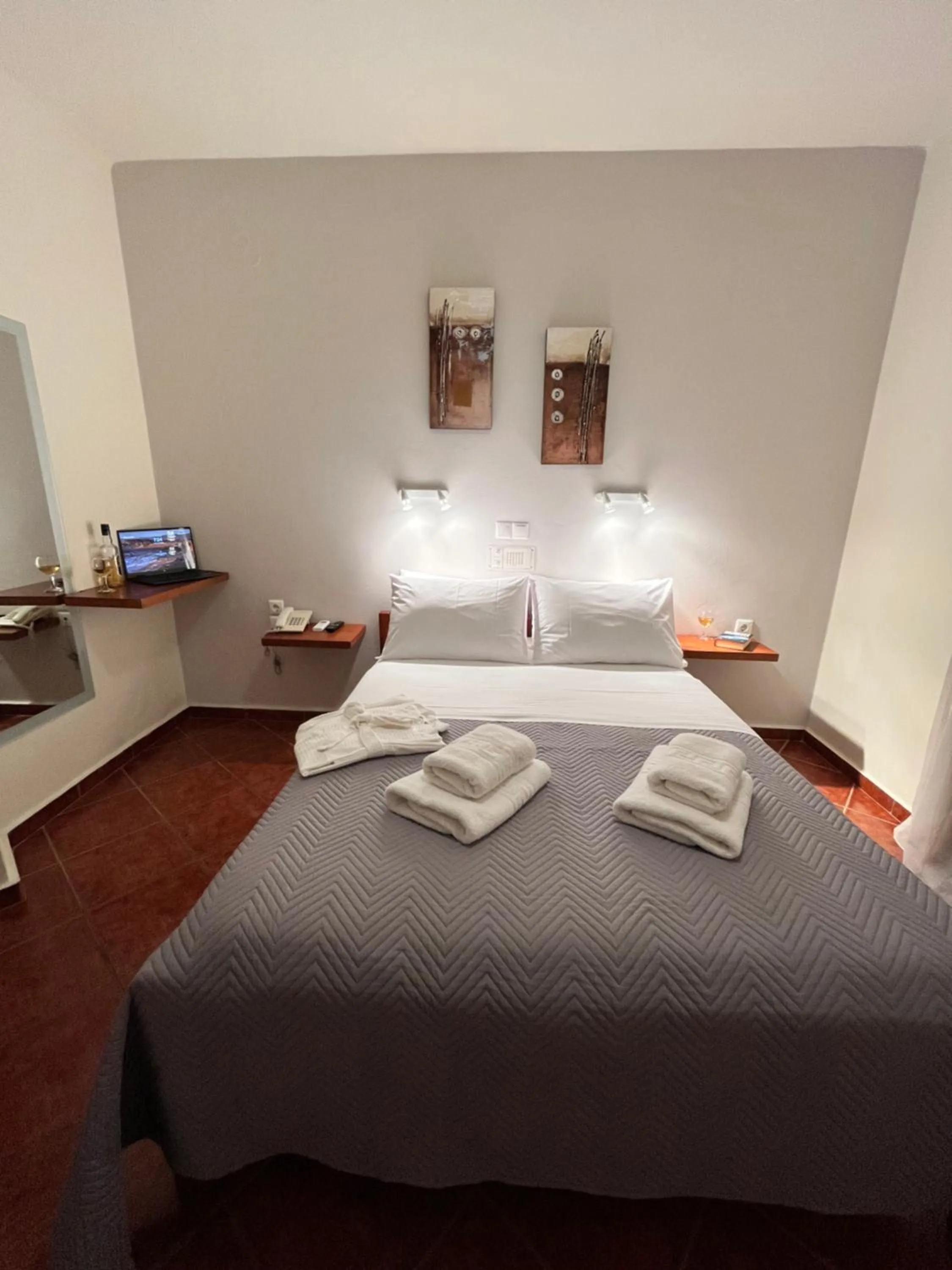 Bed in Iolkos Hotel Apartments