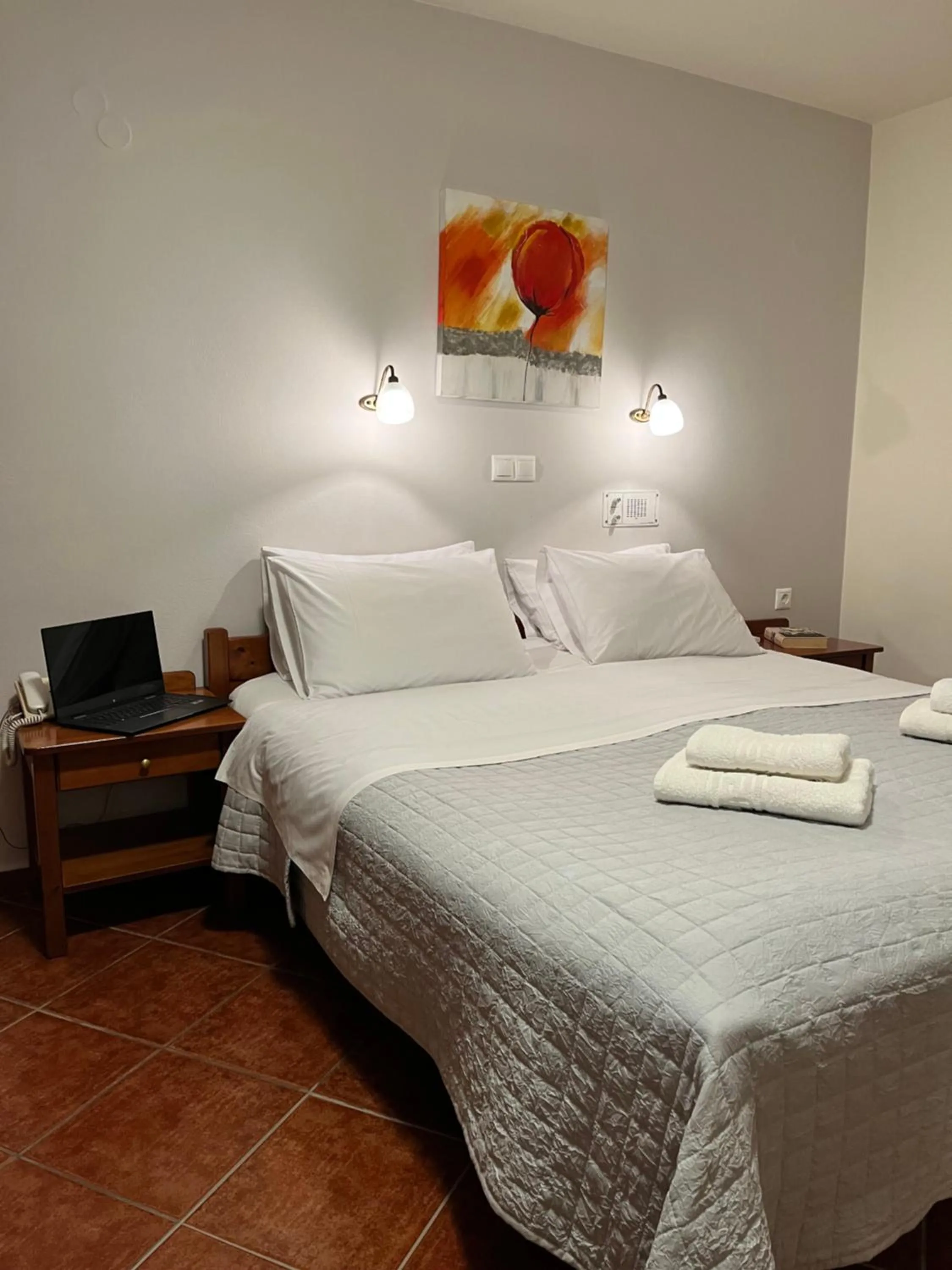 Bed in Iolkos Hotel Apartments