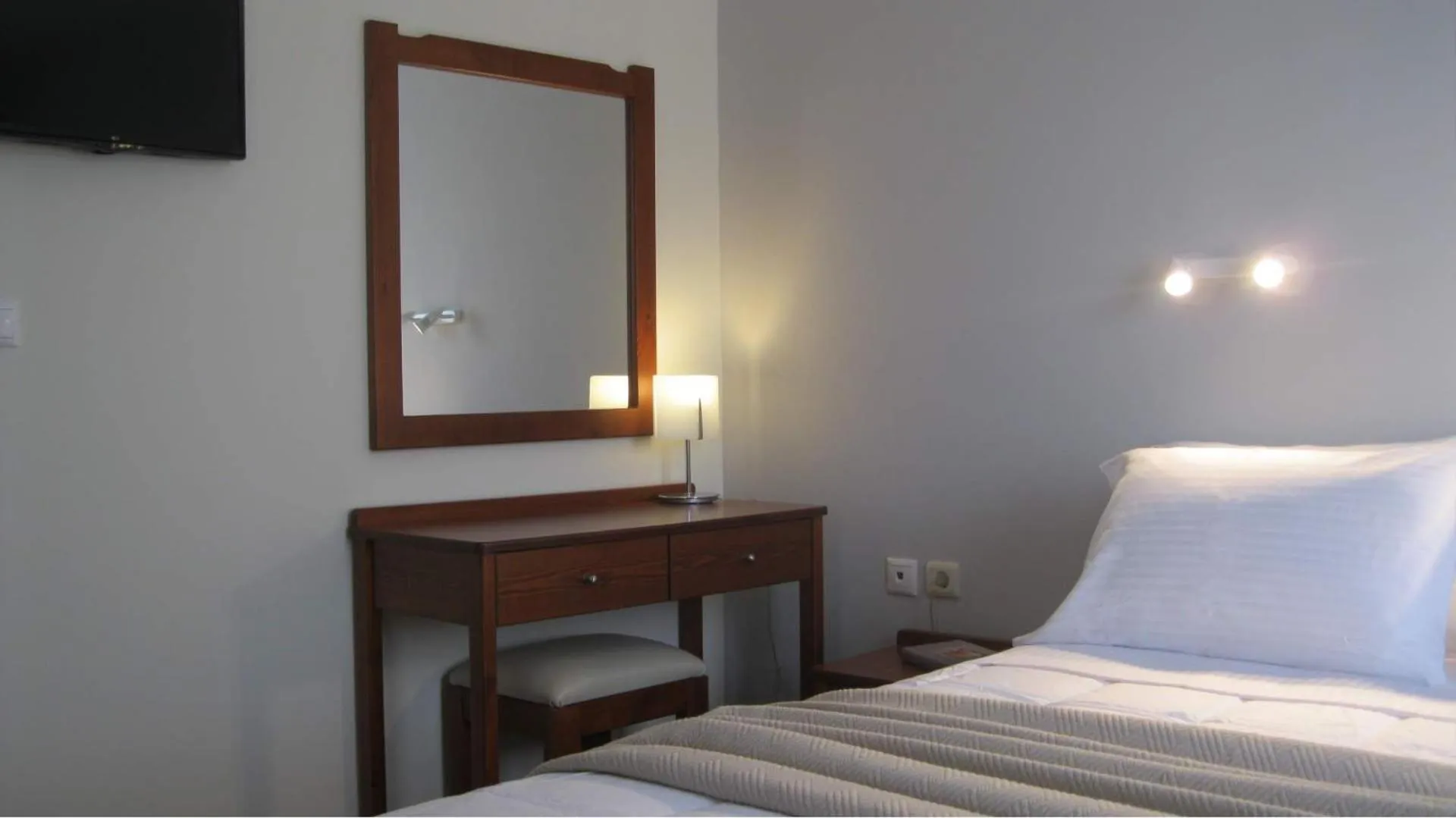 Bed in Iolkos Hotel Apartments