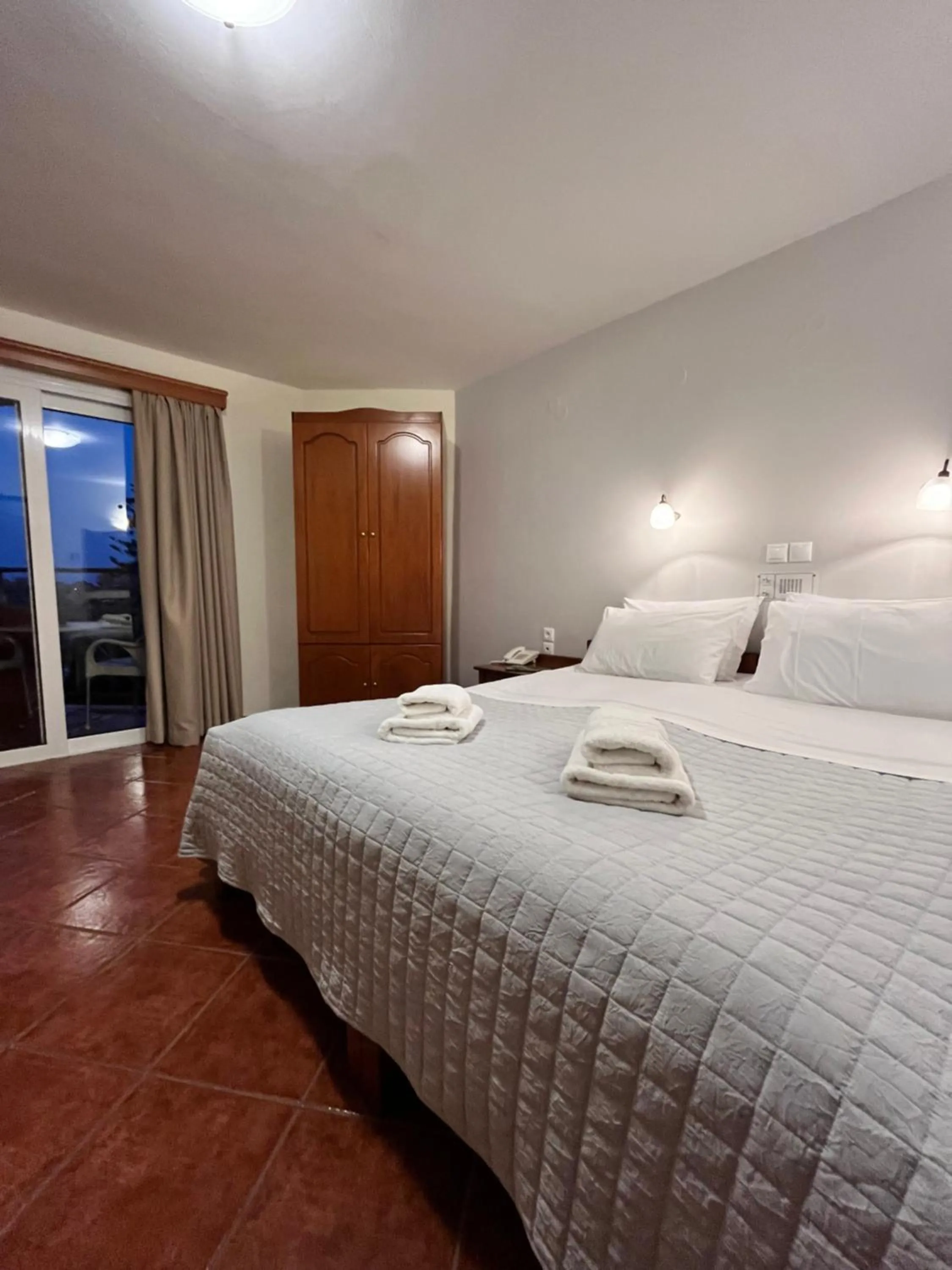 Bed in Iolkos Hotel Apartments