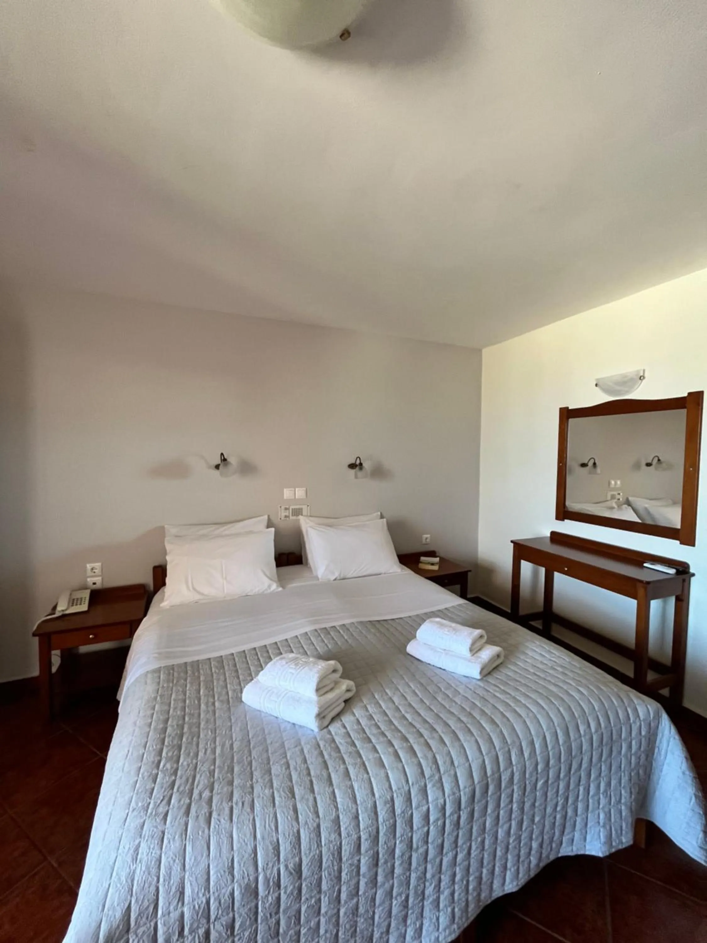 Bed in Iolkos Hotel Apartments