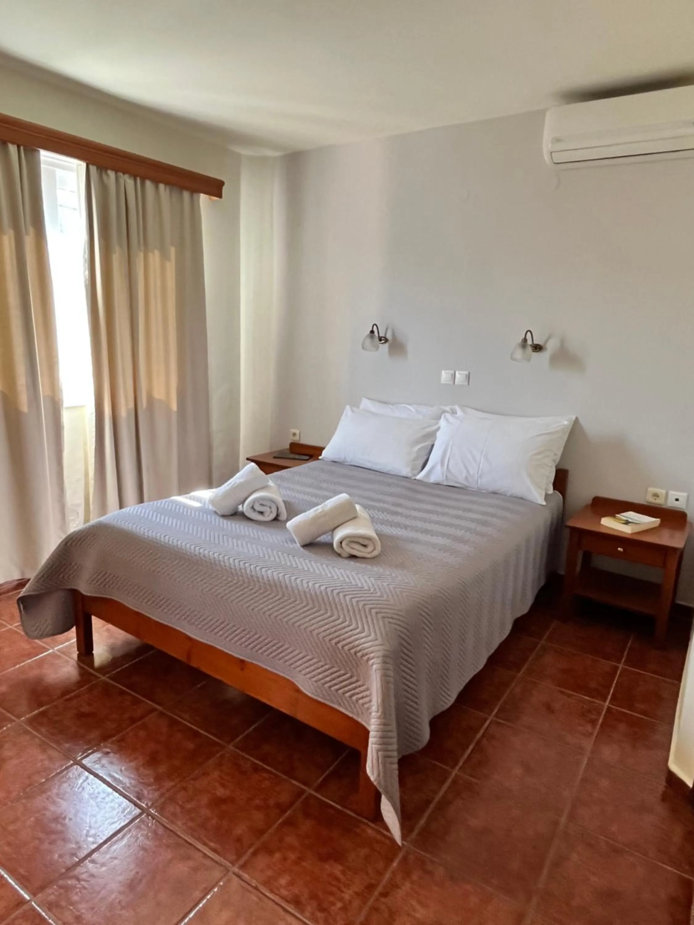 Bed in Iolkos Hotel Apartments