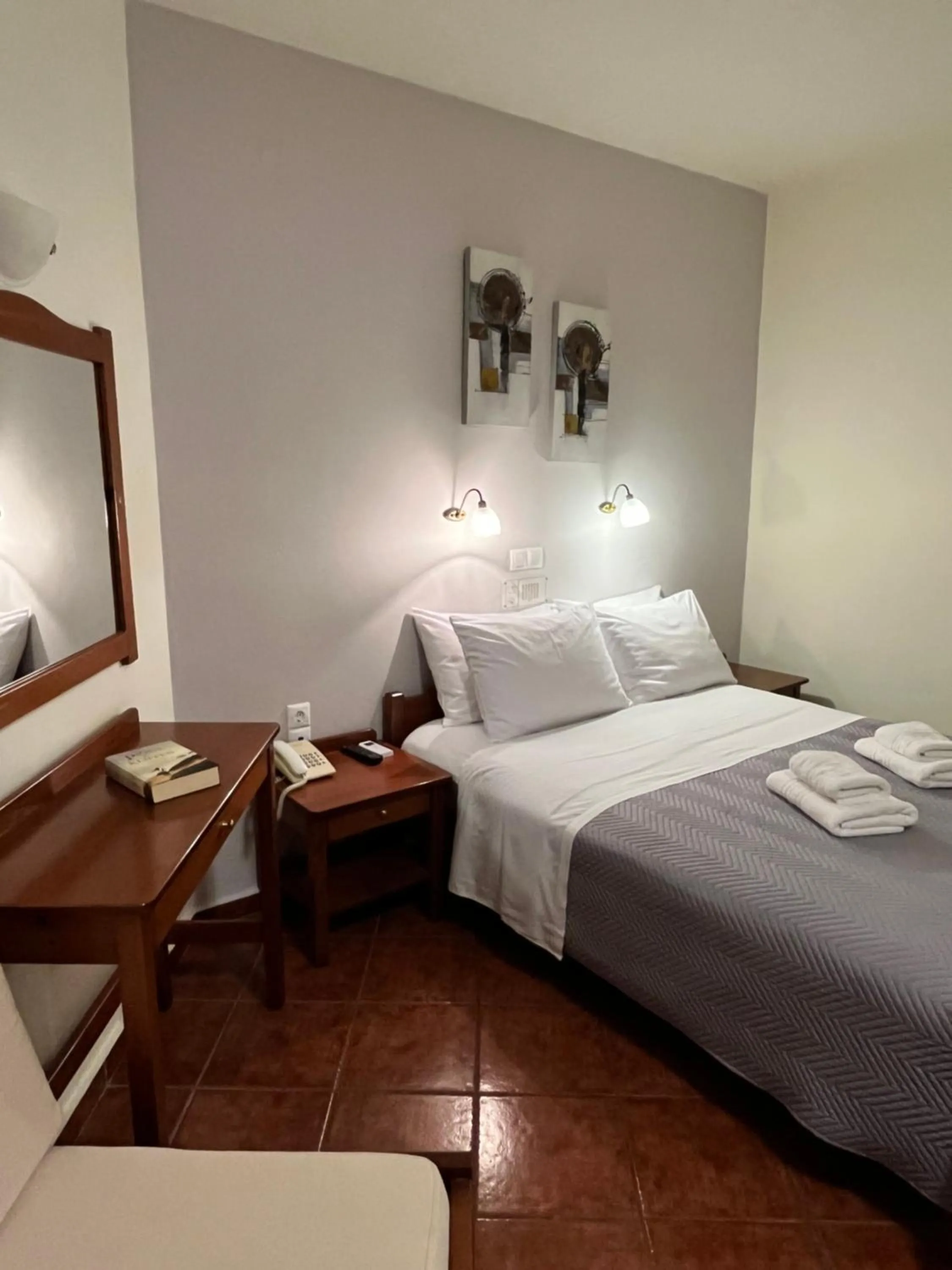 Bed in Iolkos Hotel Apartments