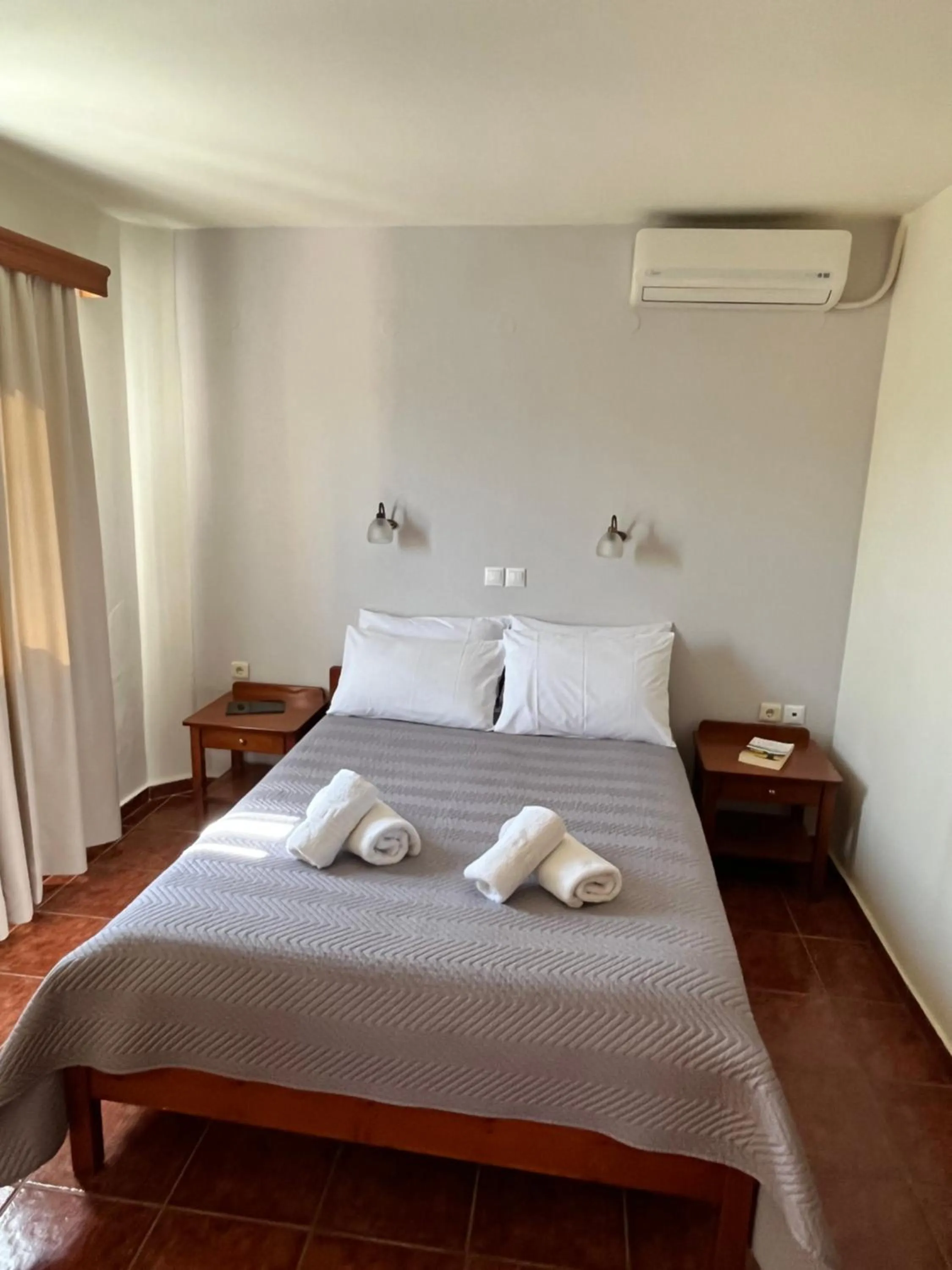 Bed in Iolkos Hotel Apartments