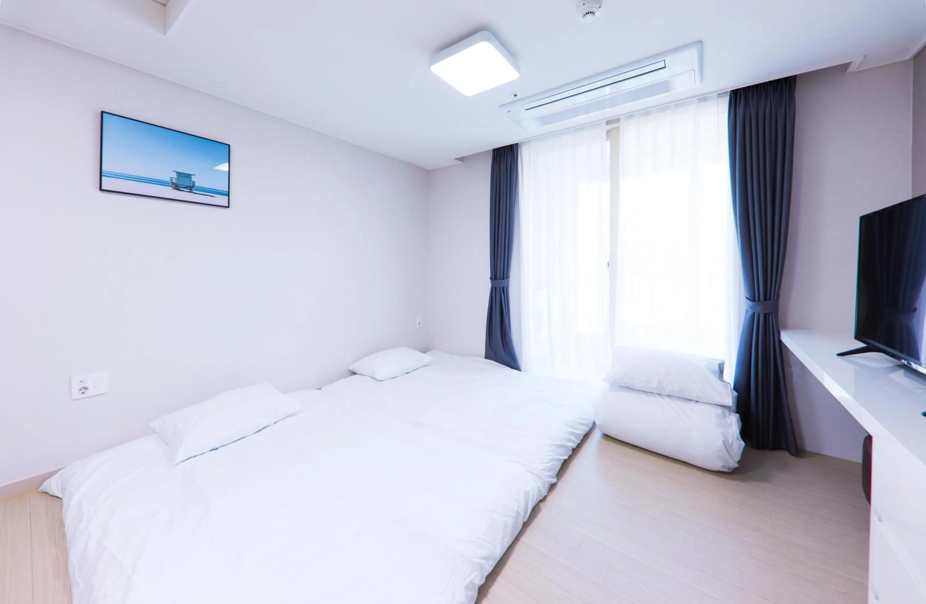 Bed in Geoje Leein Stay Hotel