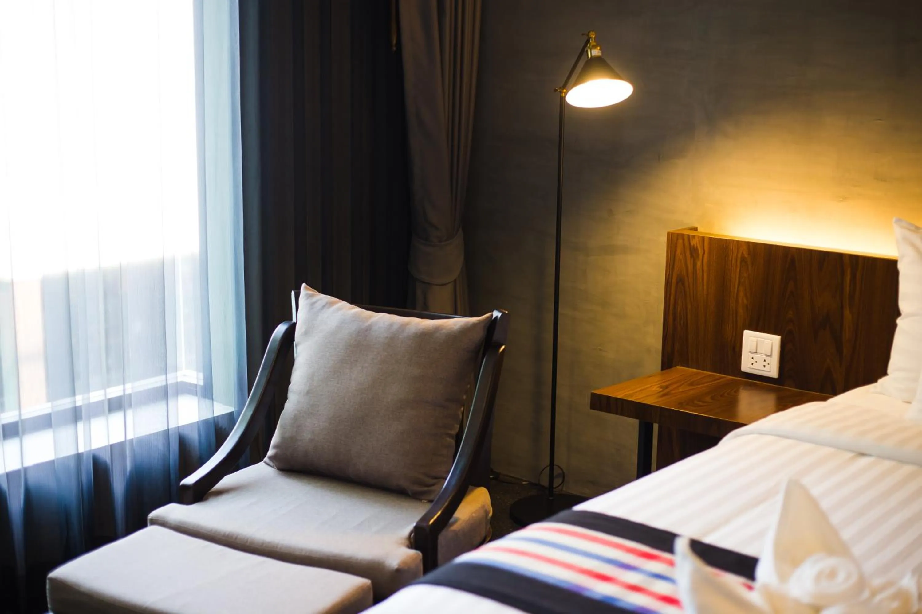 Seating area, Bed in NAI YA Hotel -SHA Extra Plus