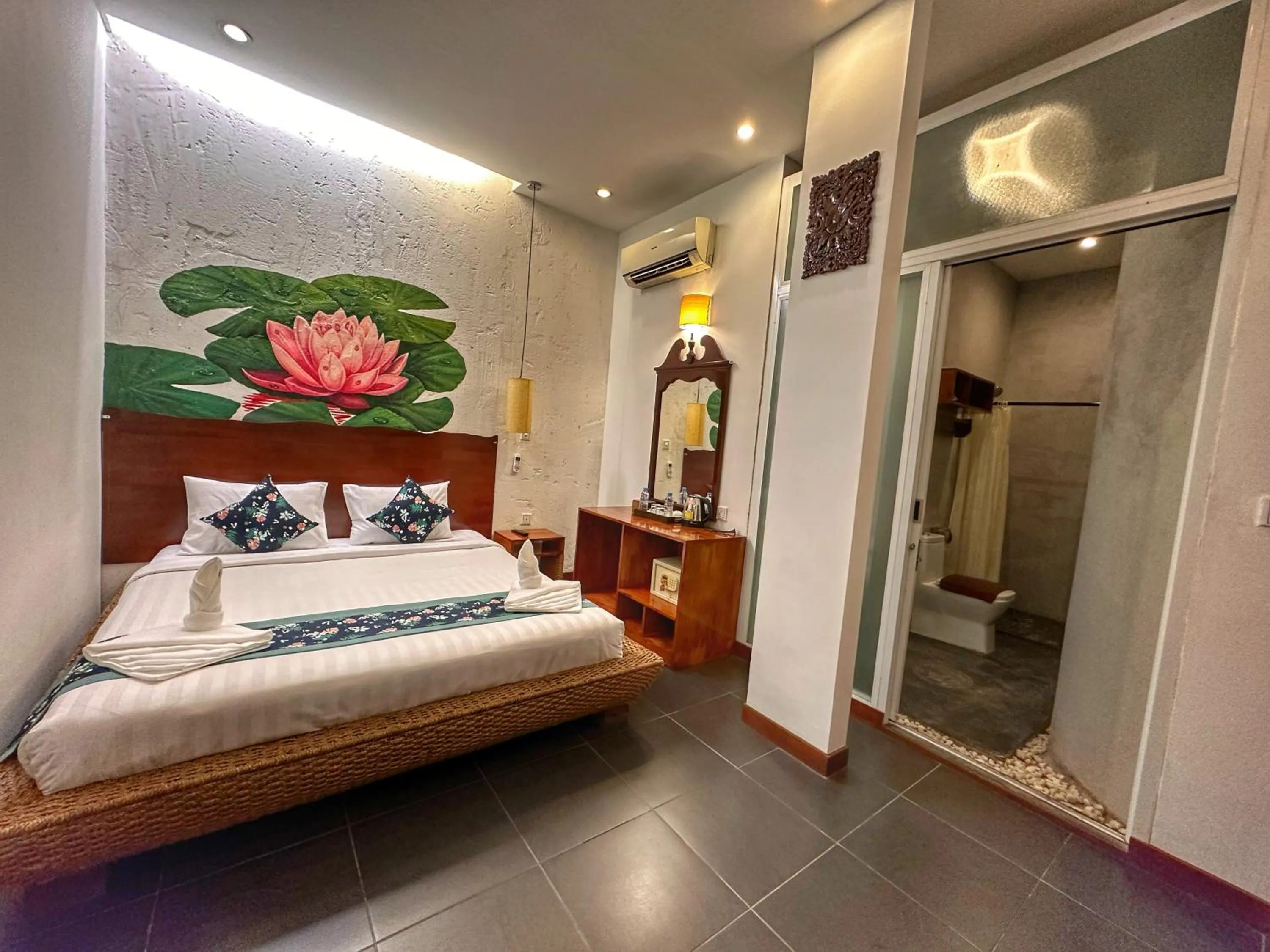 Bed in Monsoon Riverside Hotel