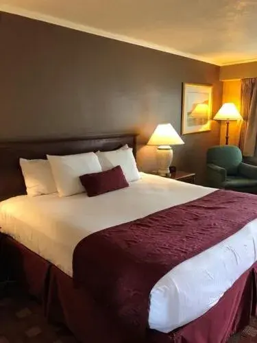 Bedroom, Bed in Days Inn & Suites by Wyndham Logan Bedroom, Bed in Days Inn & Suites by Wyndham Logan