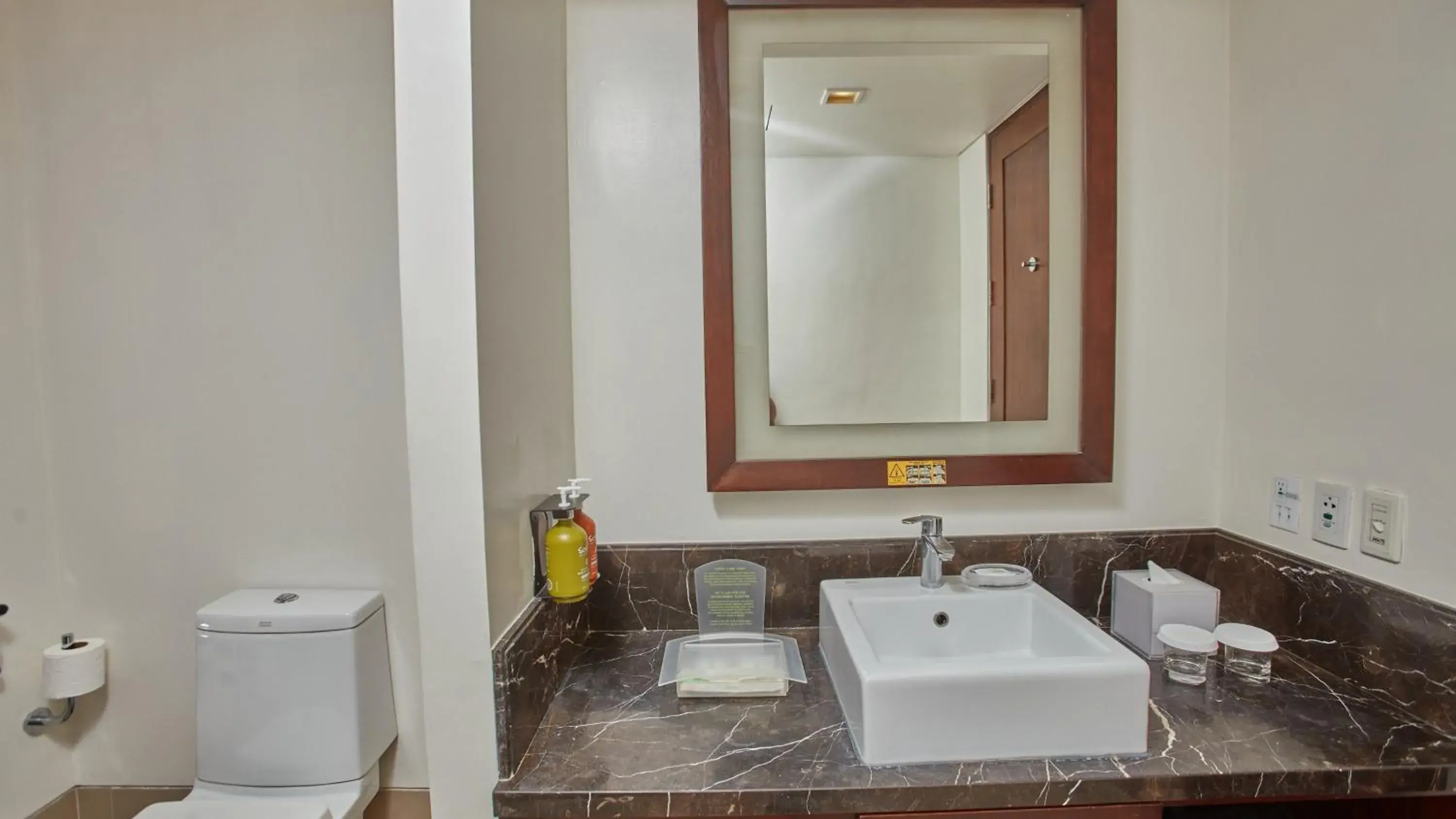 Bathroom in Holiday Inn & Suites Makati by IHG Bathroom in Holiday Inn & Suites Makati by IHG