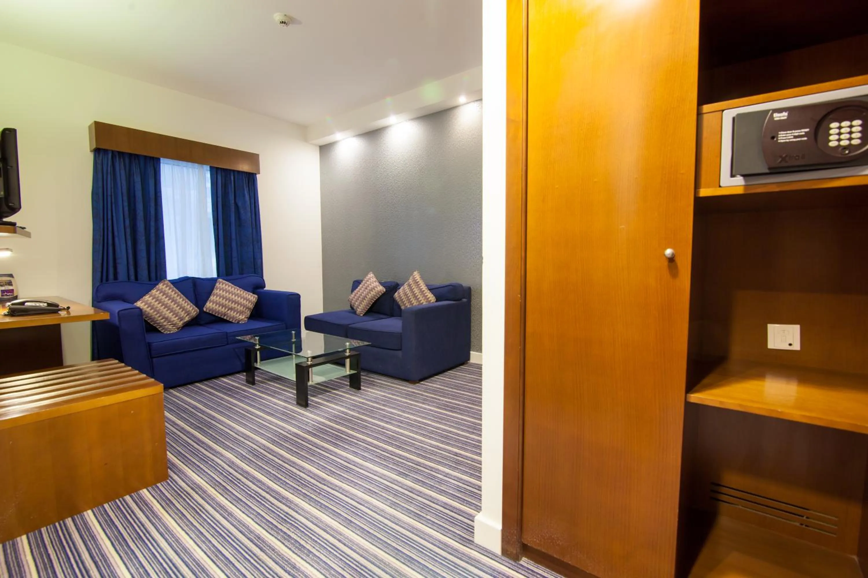 Communal lounge/ TV room in Holiday Bahrain Hotel