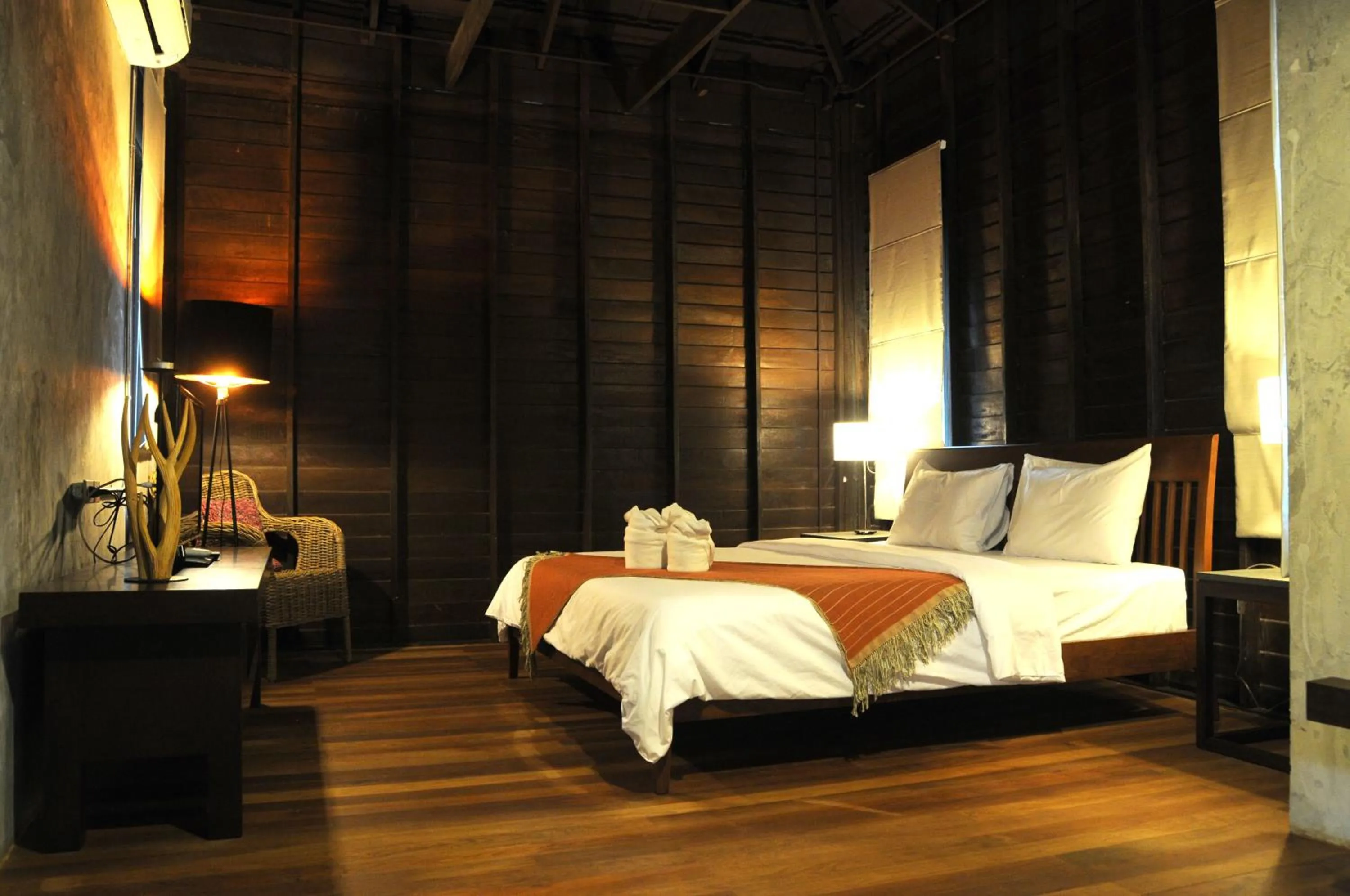 Bed in Baan Suan Ramita Resort