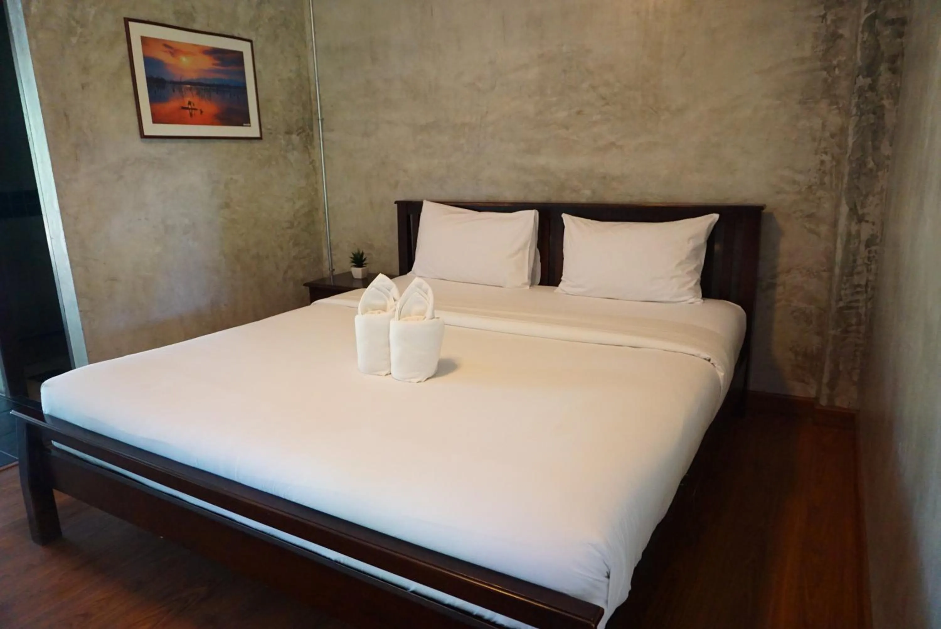 Bed in Baan Suan Ramita Resort