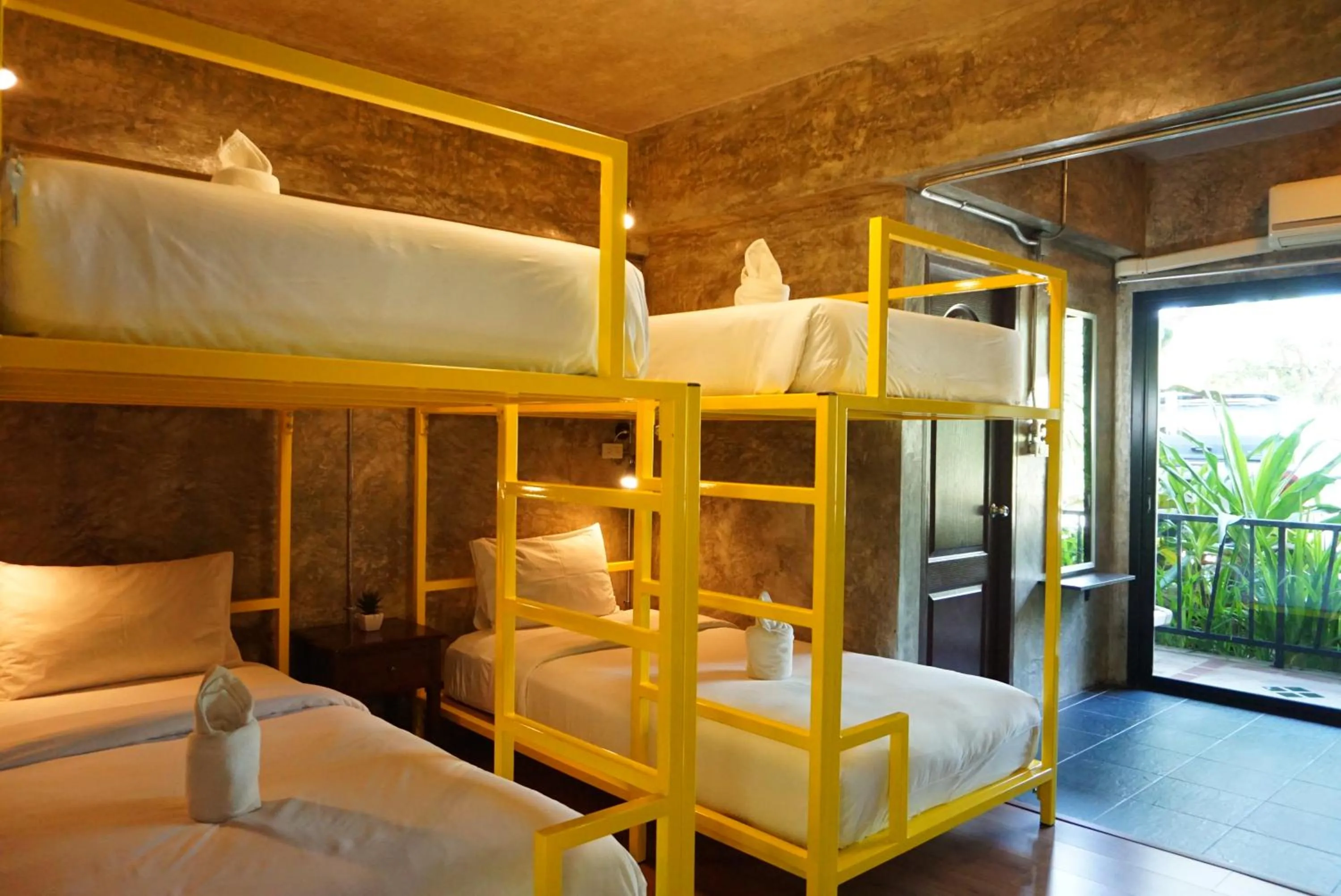 Bed in Baan Suan Ramita Resort