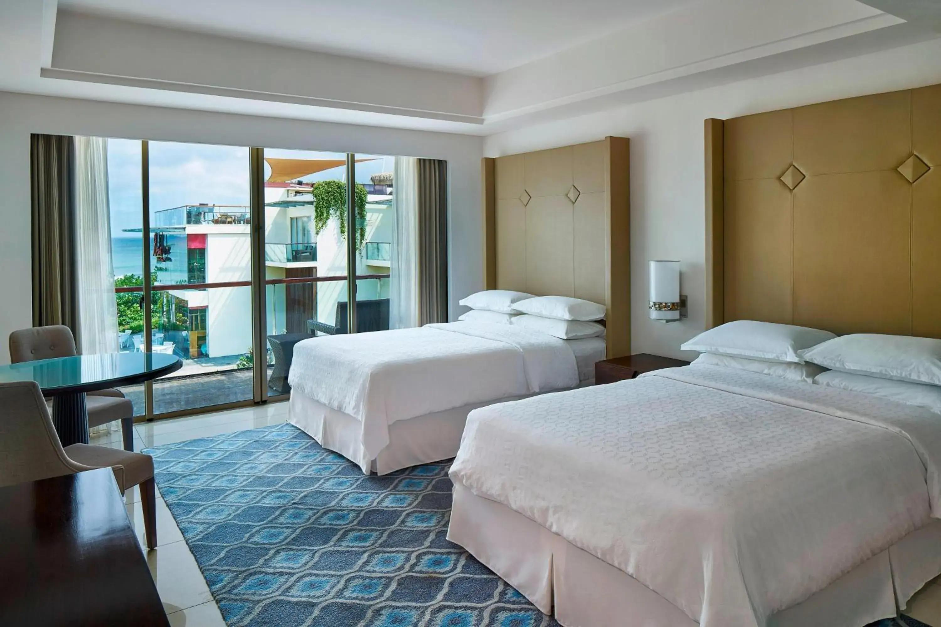 Guest Room Ocean View, 2 Double Beds (suitable for 2 adults & 2 children below 12 y.o. or 3 adults with Extra Bed ) in Sheraton Bali Kuta Resort Guest Room Ocean View, 2 Double Beds (suitable for 2 adults & 2 children below 12 y.o. or 3 adults with Extra Bed ) in Sheraton Bali Kuta Resort