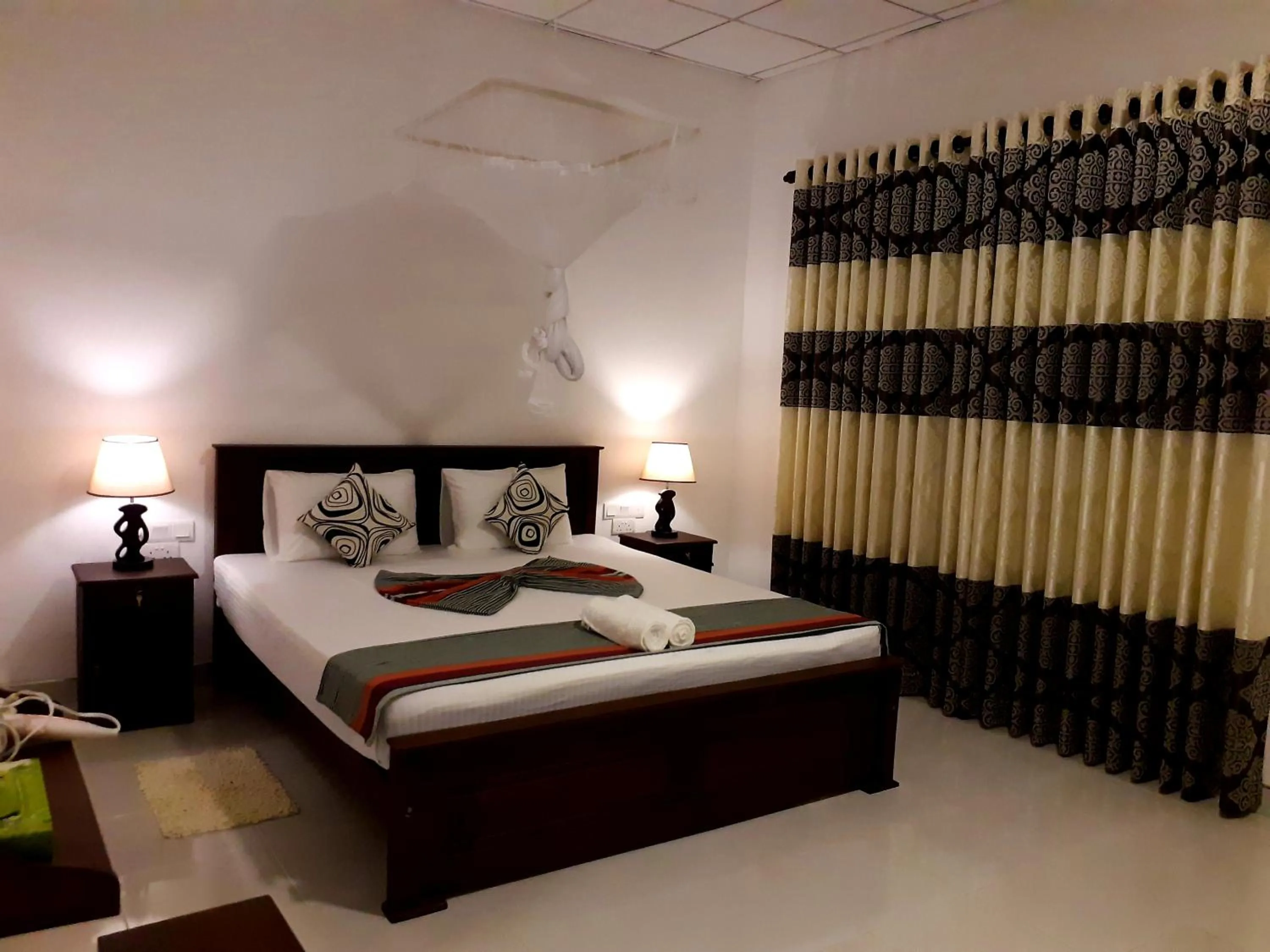 Bed in Sigiri Hibiscus Villa