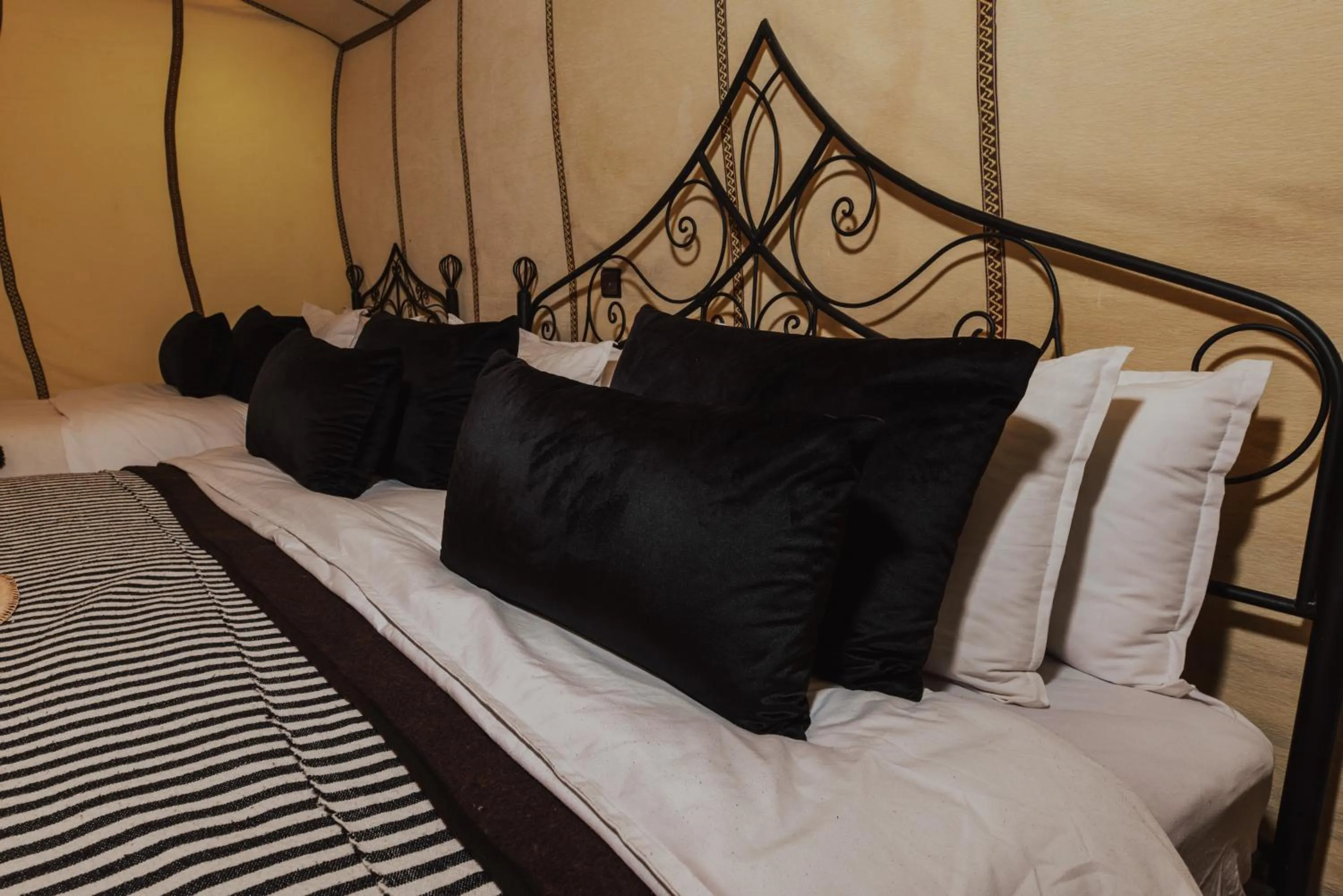 Bed in Tassili Luxury Desert Camp