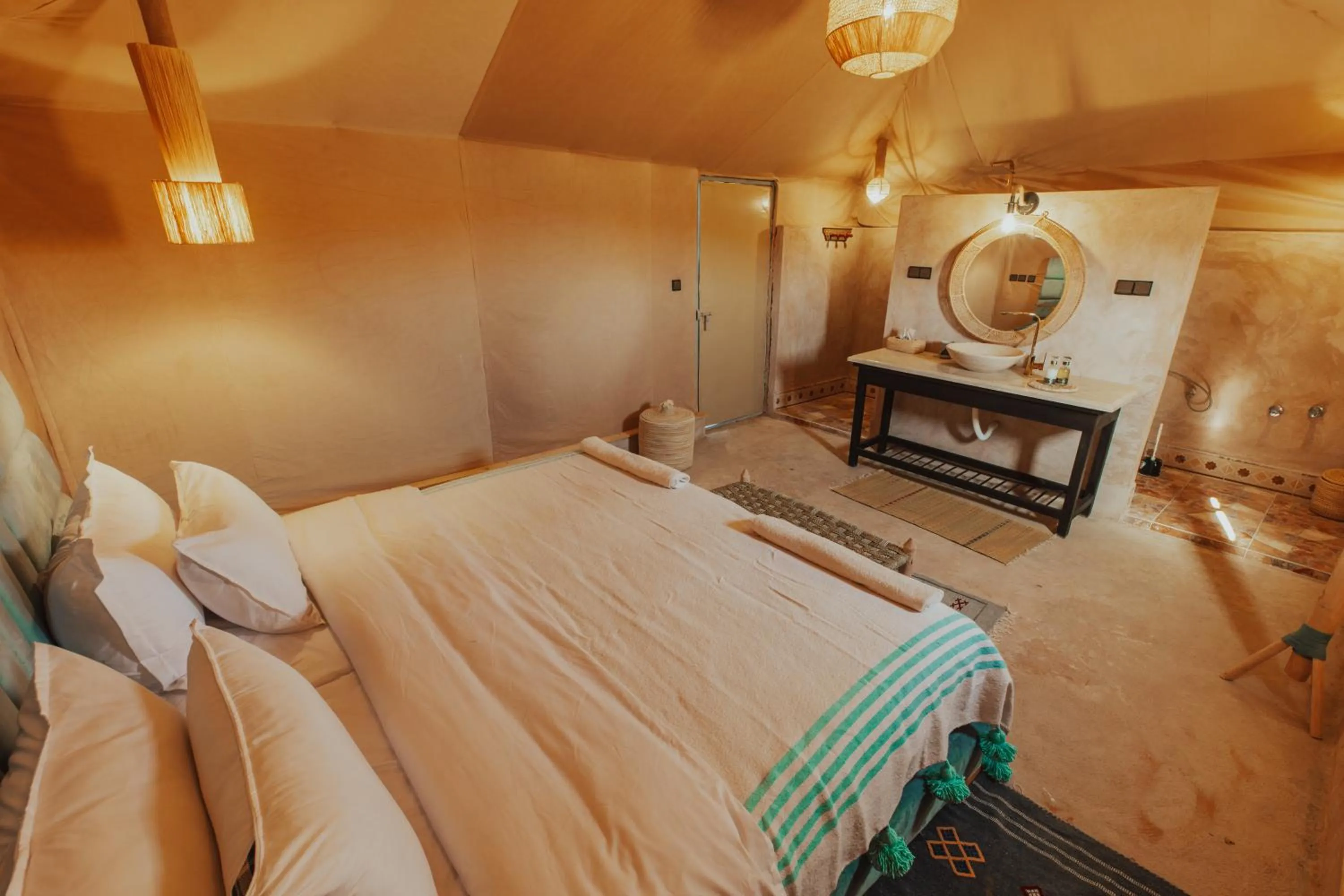 Bed in Tassili Luxury Desert Camp