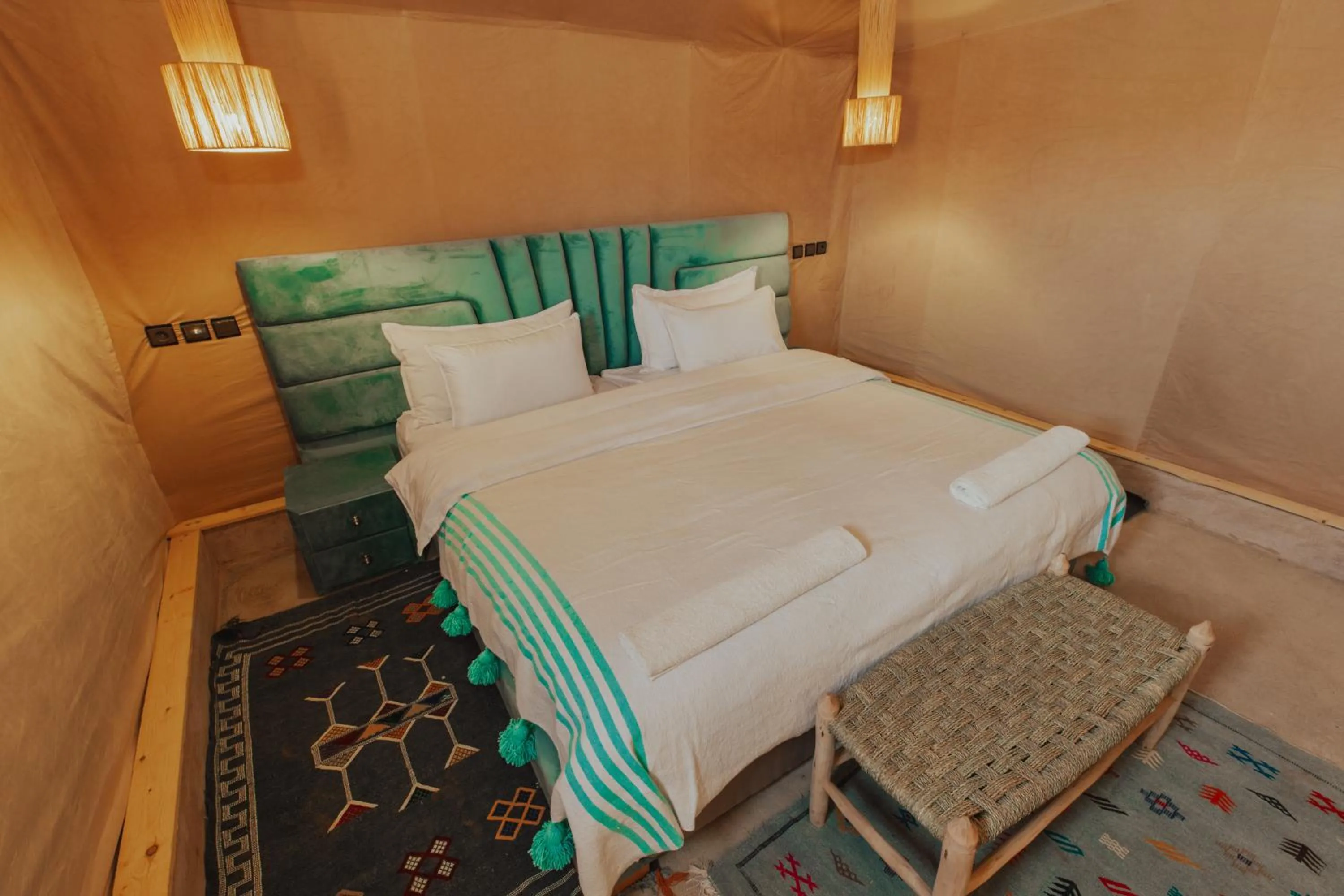 Bed in Tassili Luxury Desert Camp