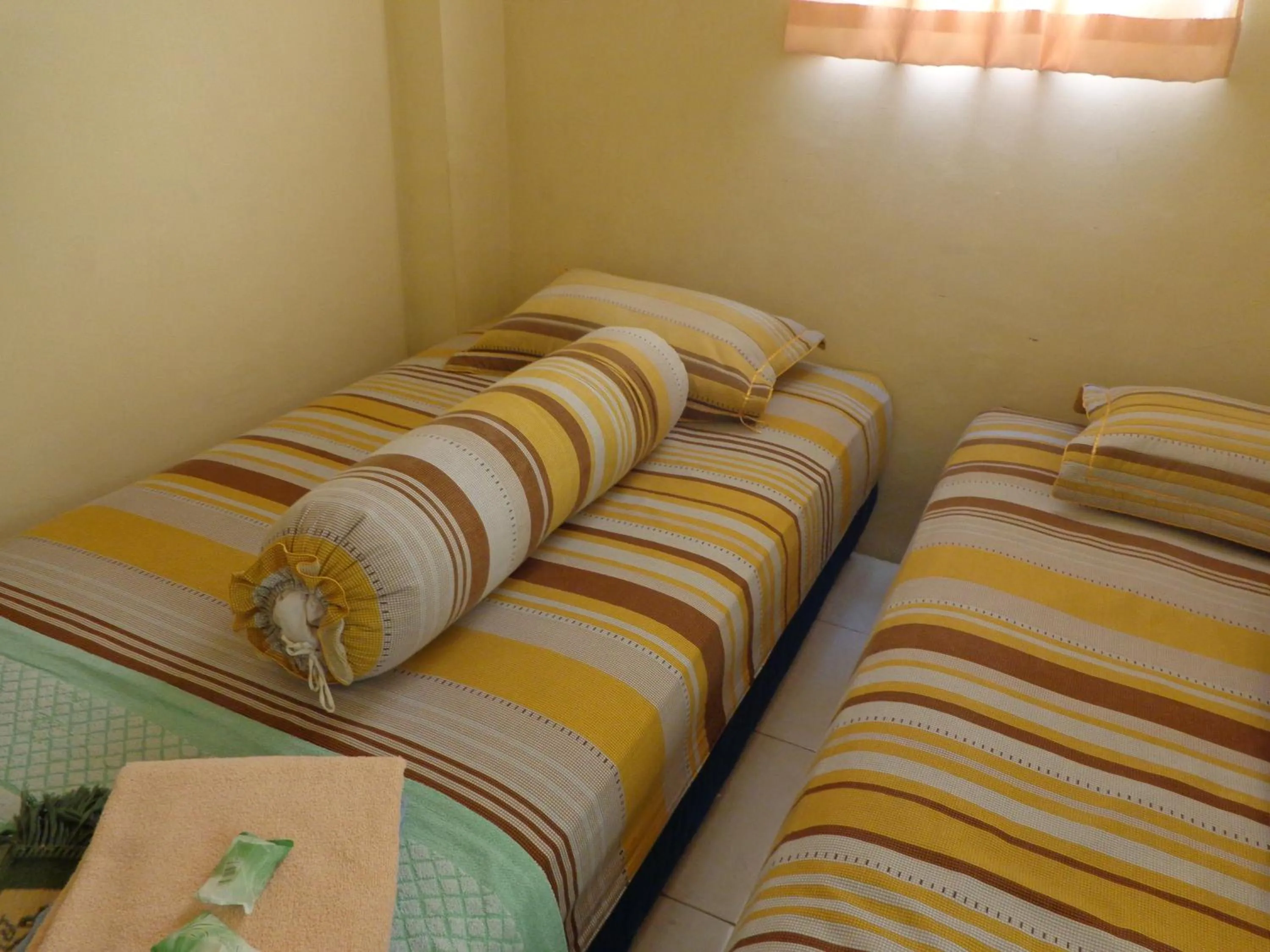 Bed in Hotel Musafir Inn