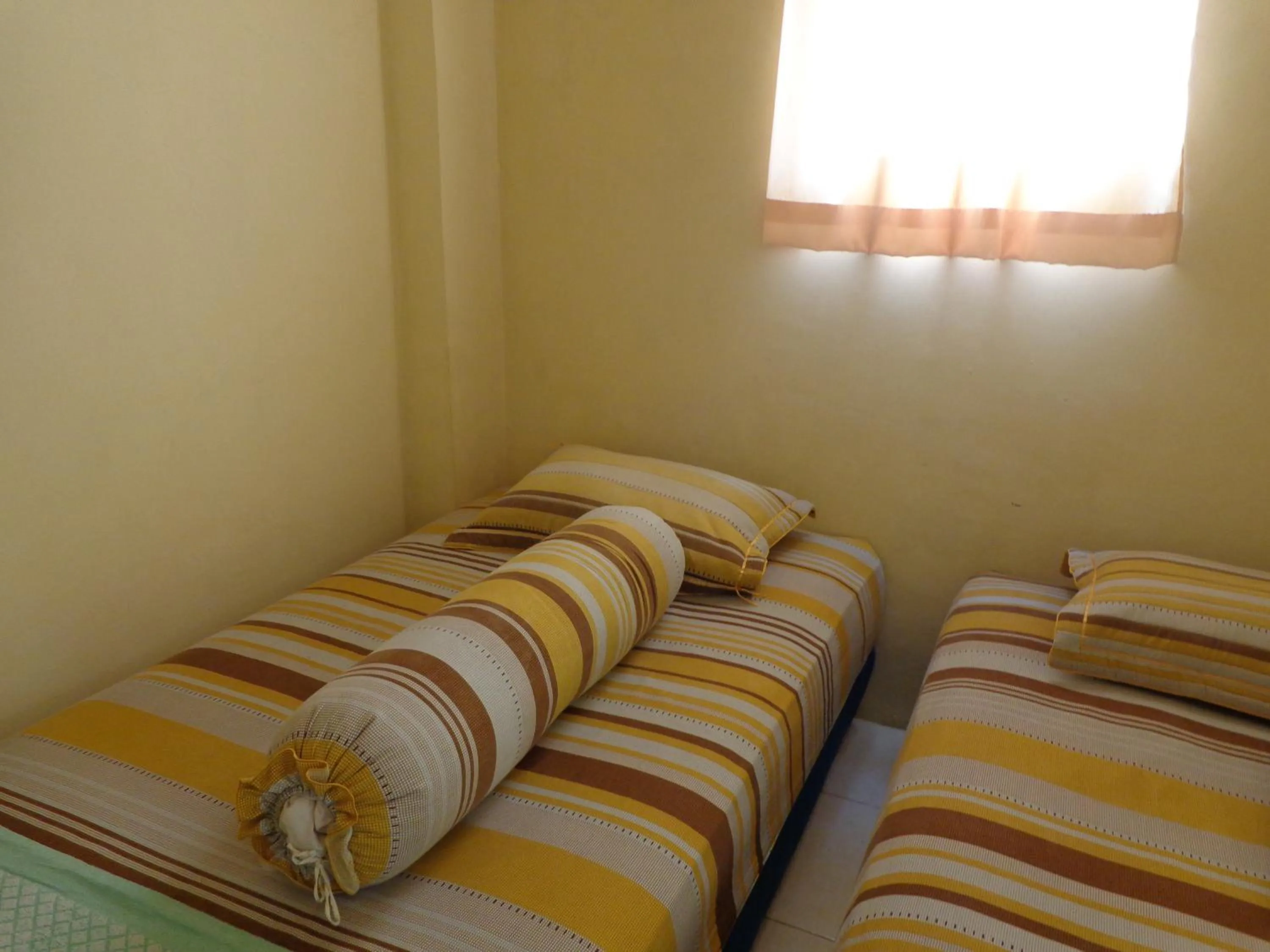 Bed in Hotel Musafir Inn