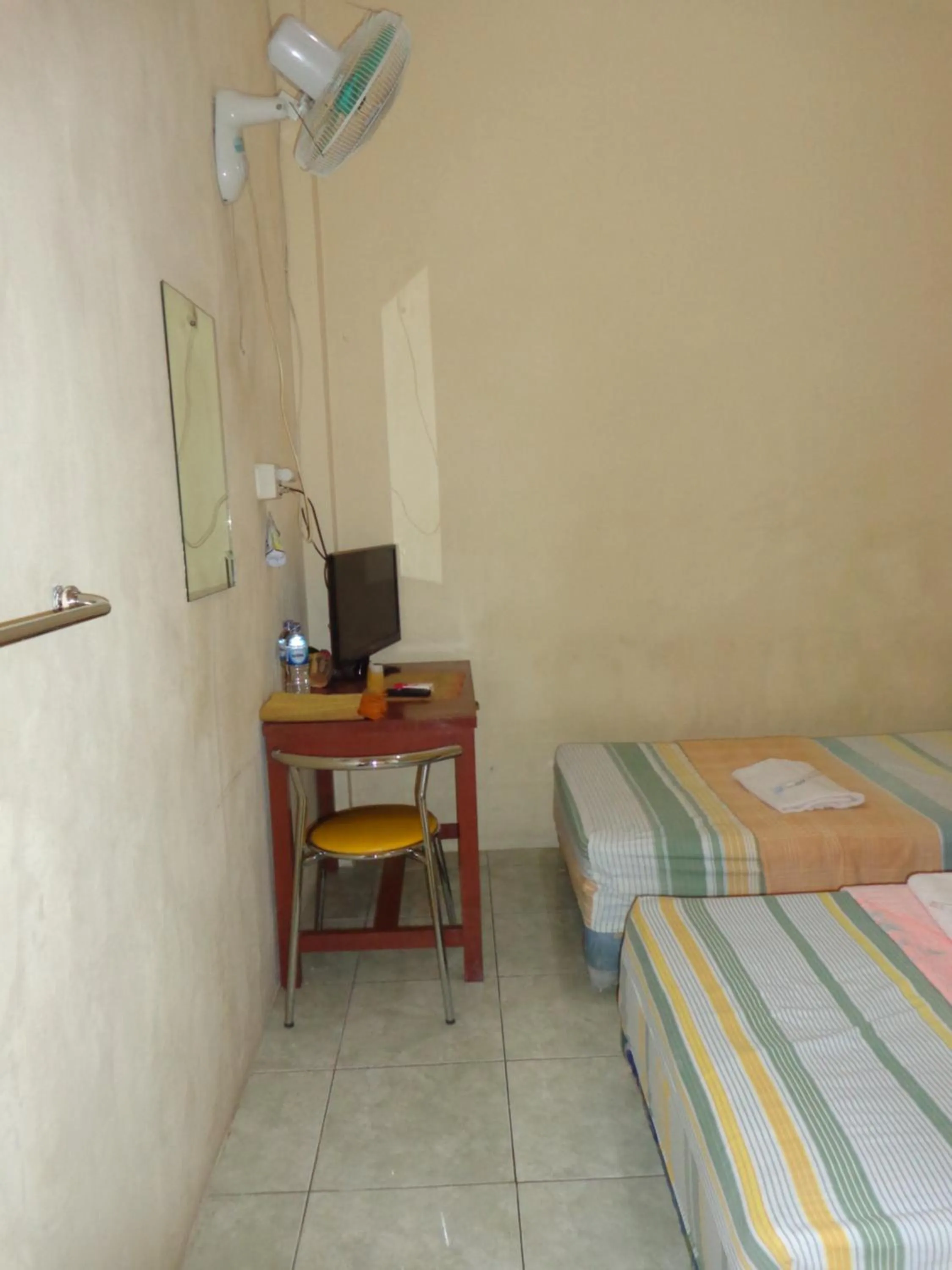 Bed in Hotel Musafir Inn